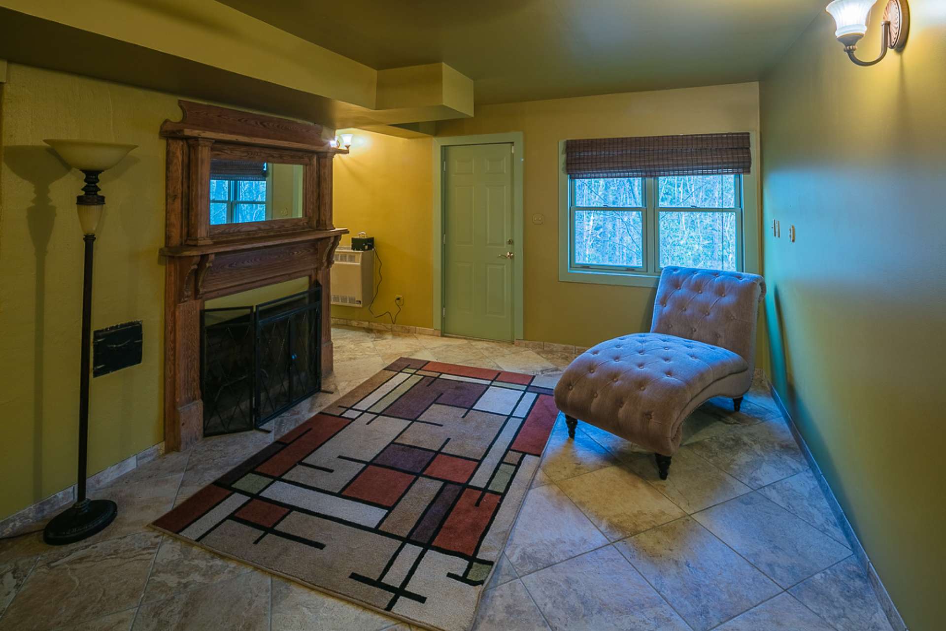 There is plenty of space for sitting around the fireplace, watching the TV, and have a pool table or other gaming options.