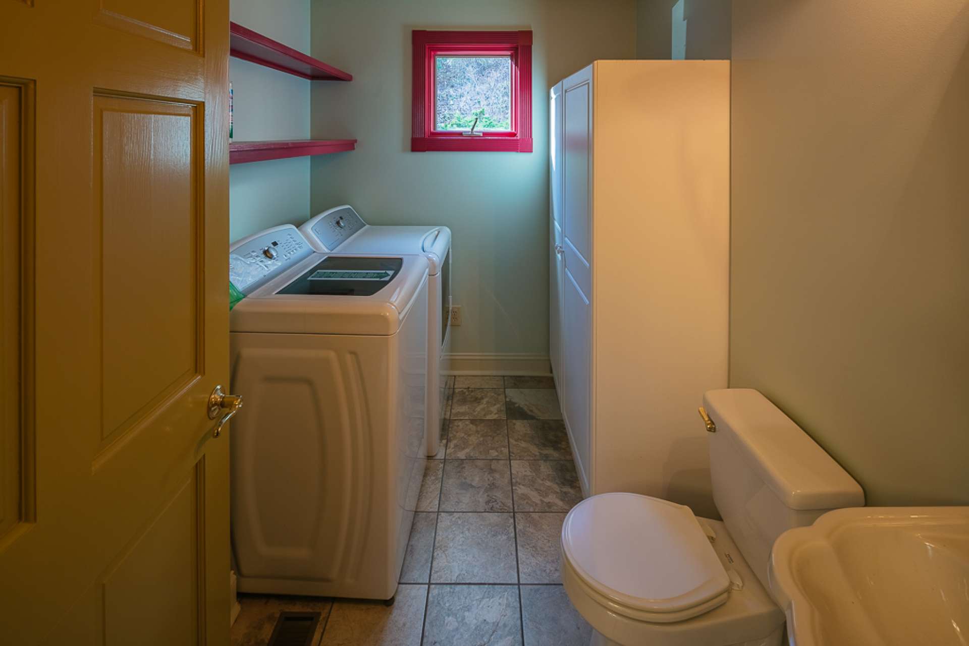 A laundry room with half bath completes the main level.
