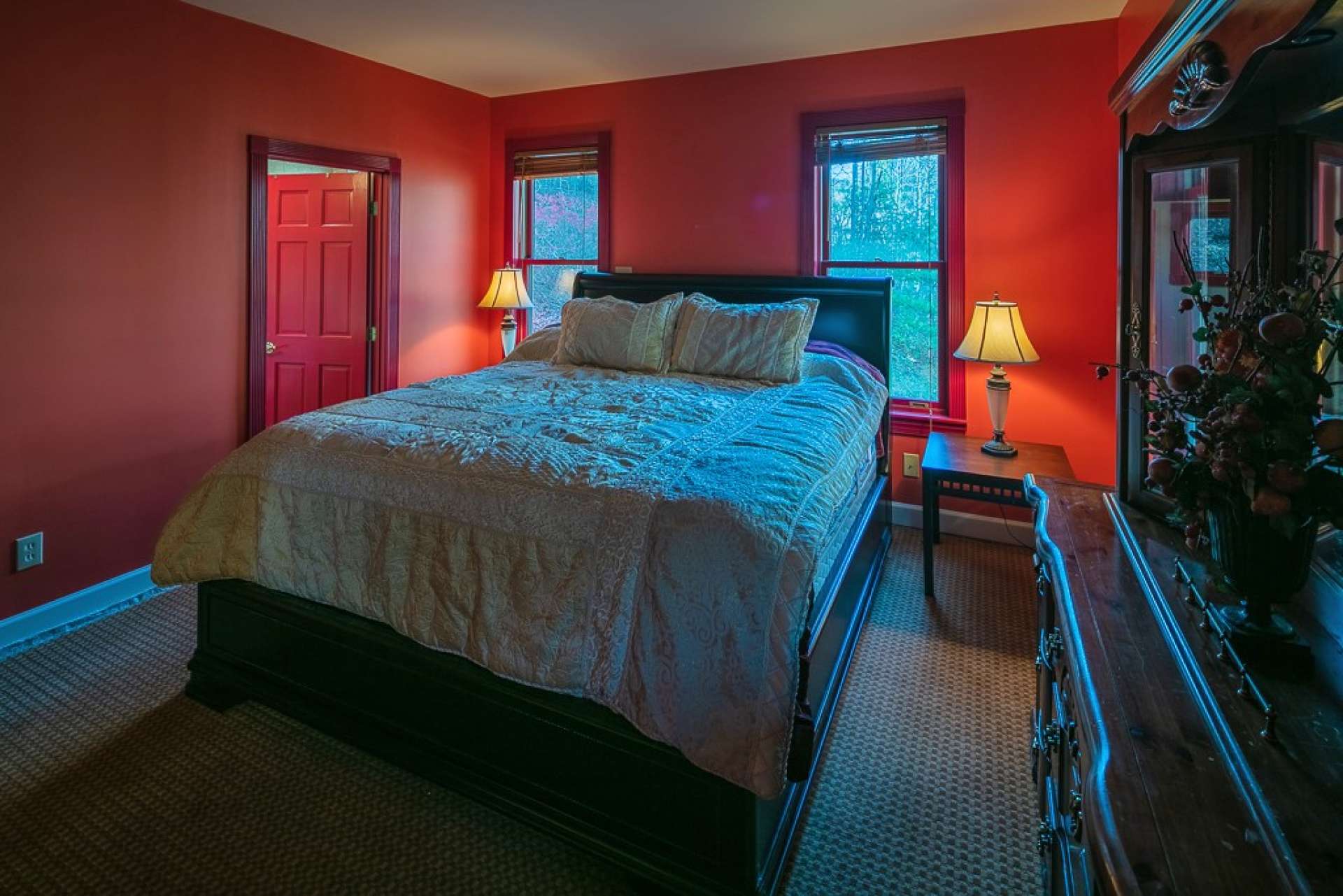 The master suite is located on the main level and offers  comfortable carpeted floor and a private bath.