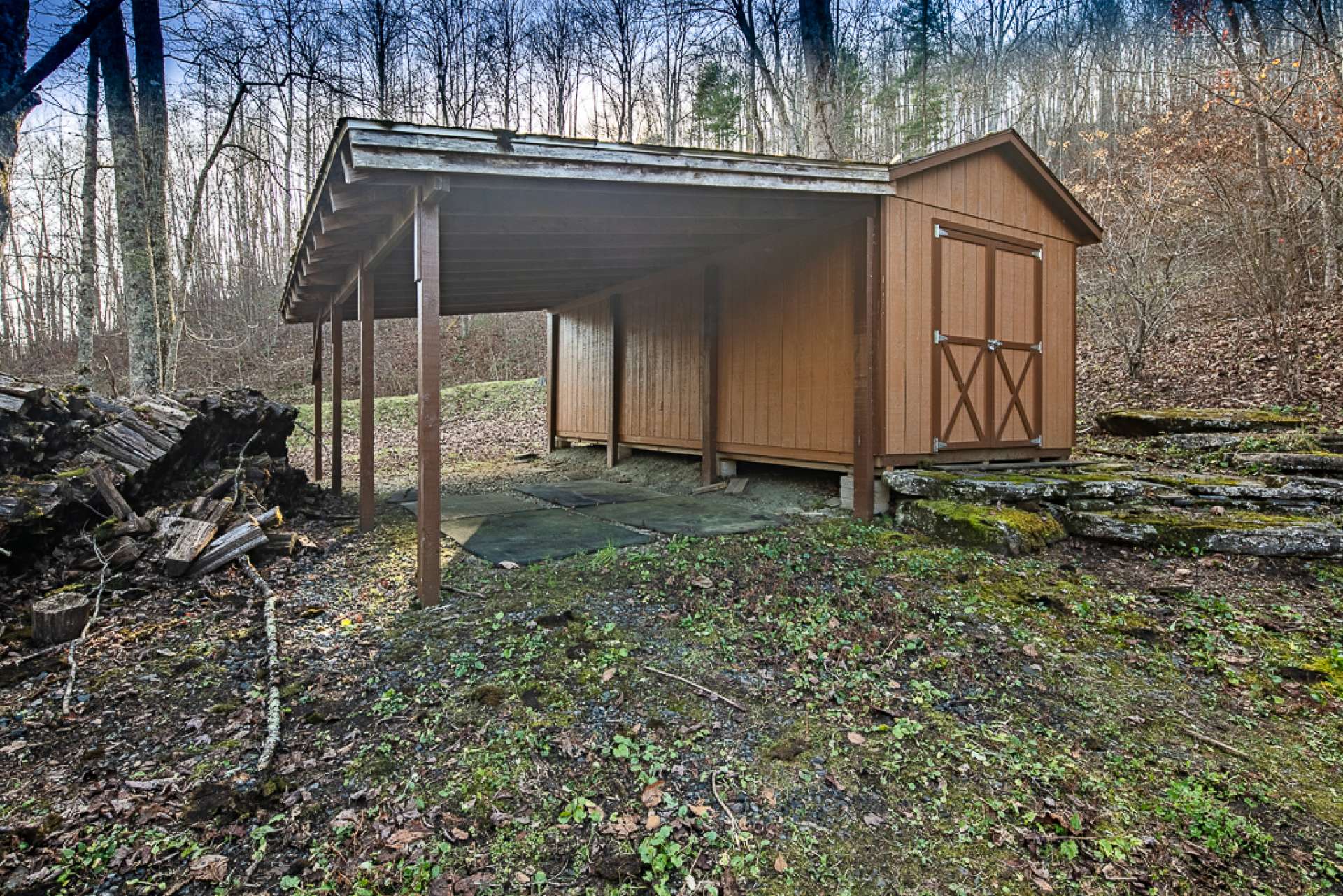 This outbuilding is ideal for lawn and gardening equipment, as well as storage for firewood.