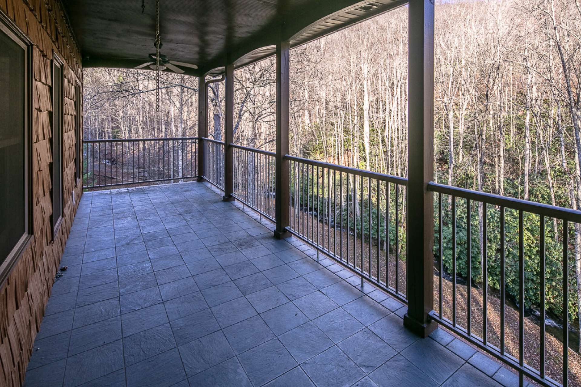 The upper level offers a covered porch to relax with the sounds of the creek and Nature.