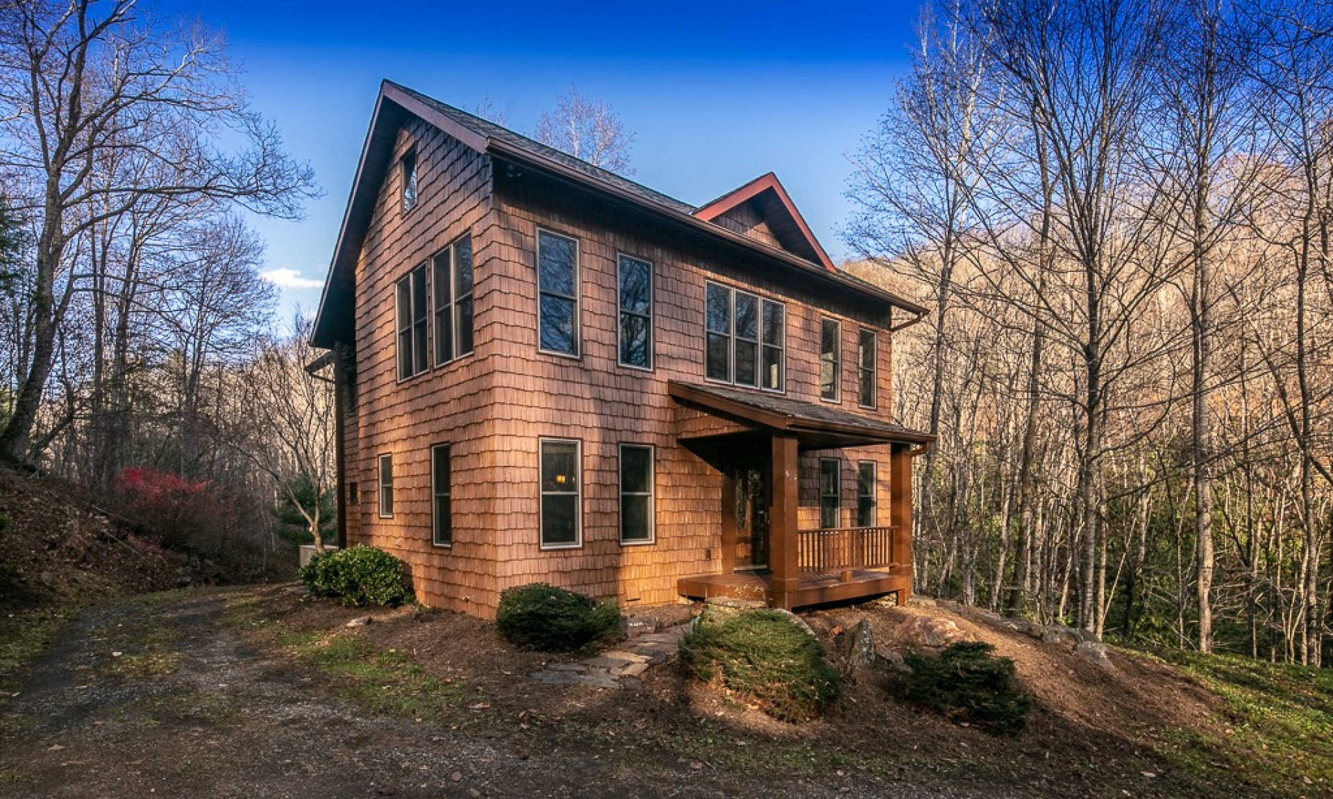 Nestled among the local flora of the gated community of Riverwalk at Todd, this  3-bedroom, 3.5-bath home is finished with just the right amount of mountain elegance.