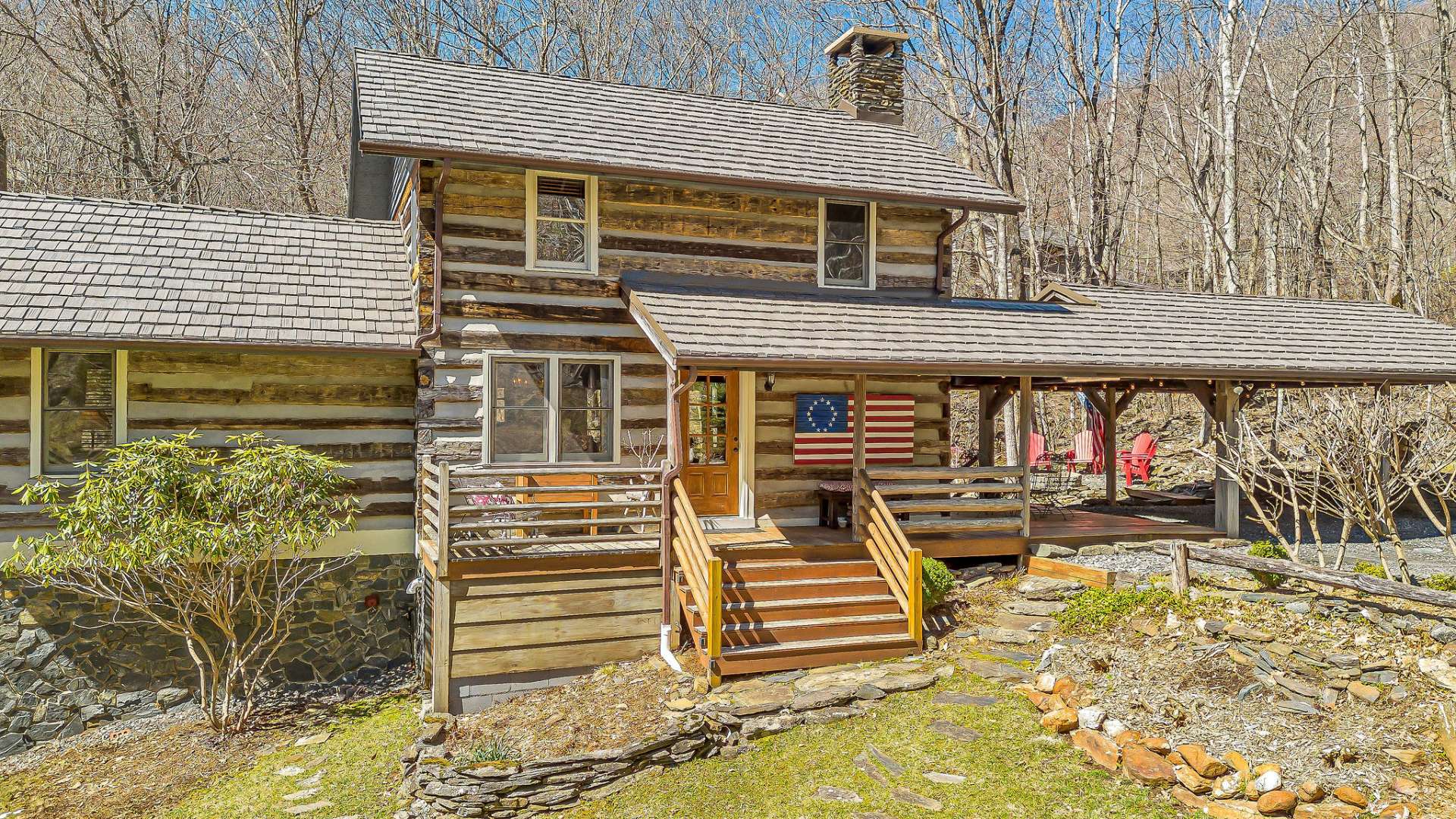 This cabin's inviting front porch is the epitome of warmth and welcome!