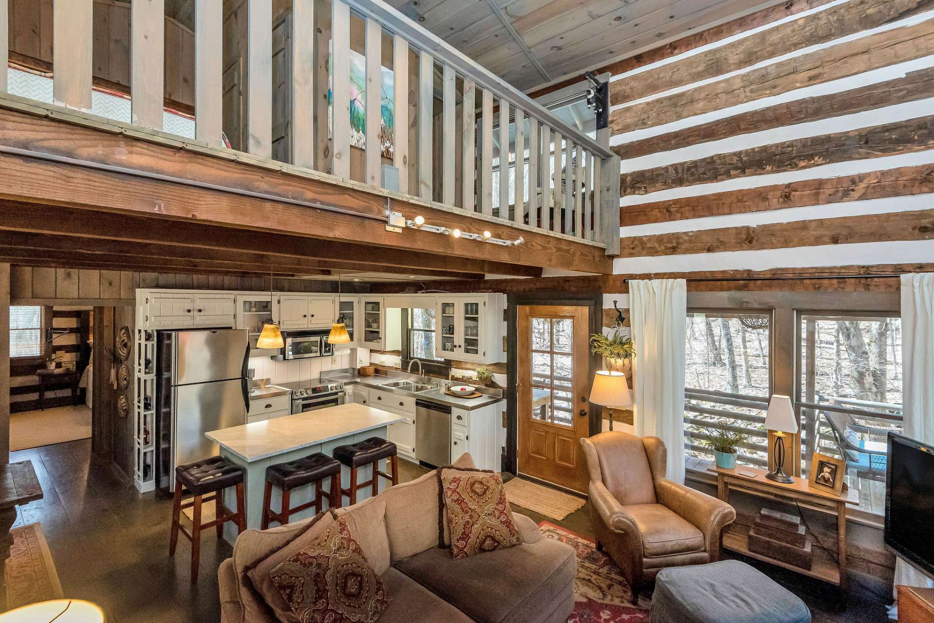 Overall, this great room exudes warmth, comfort, and rustic elegance, making it the perfect gathering place for creating cherished memories in the heart of nature.