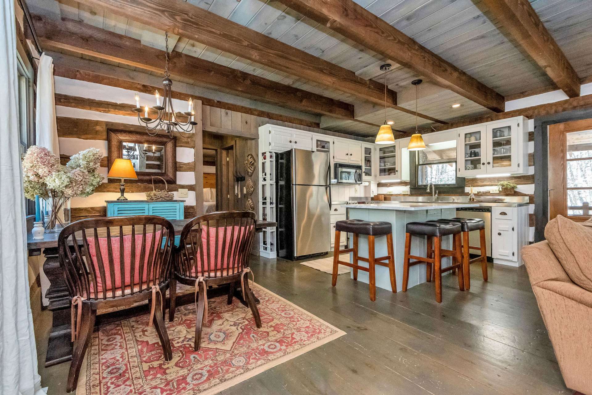 The open dining area and kitchen seamlessly blend together, creating a welcoming and functional space.