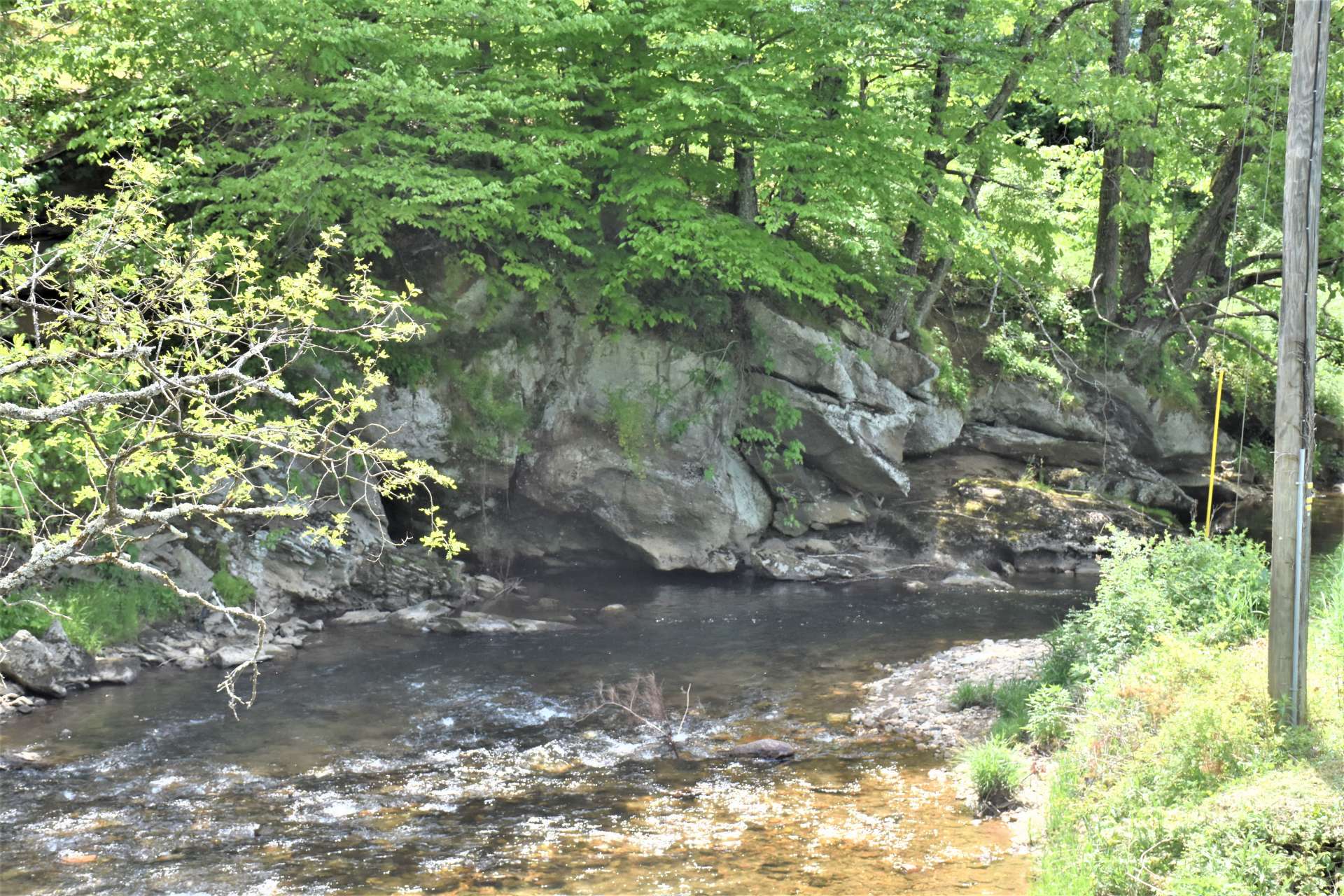 It looks like under that big rock formation would be a good place to cast your line.  Call today for more information on this sweet fixer upper NC Mountain mini farm with your own frontage on Big Horse Creek in the Lansing area of Ashe County convenient to Grayson Highlands and the West Jefferson areas.