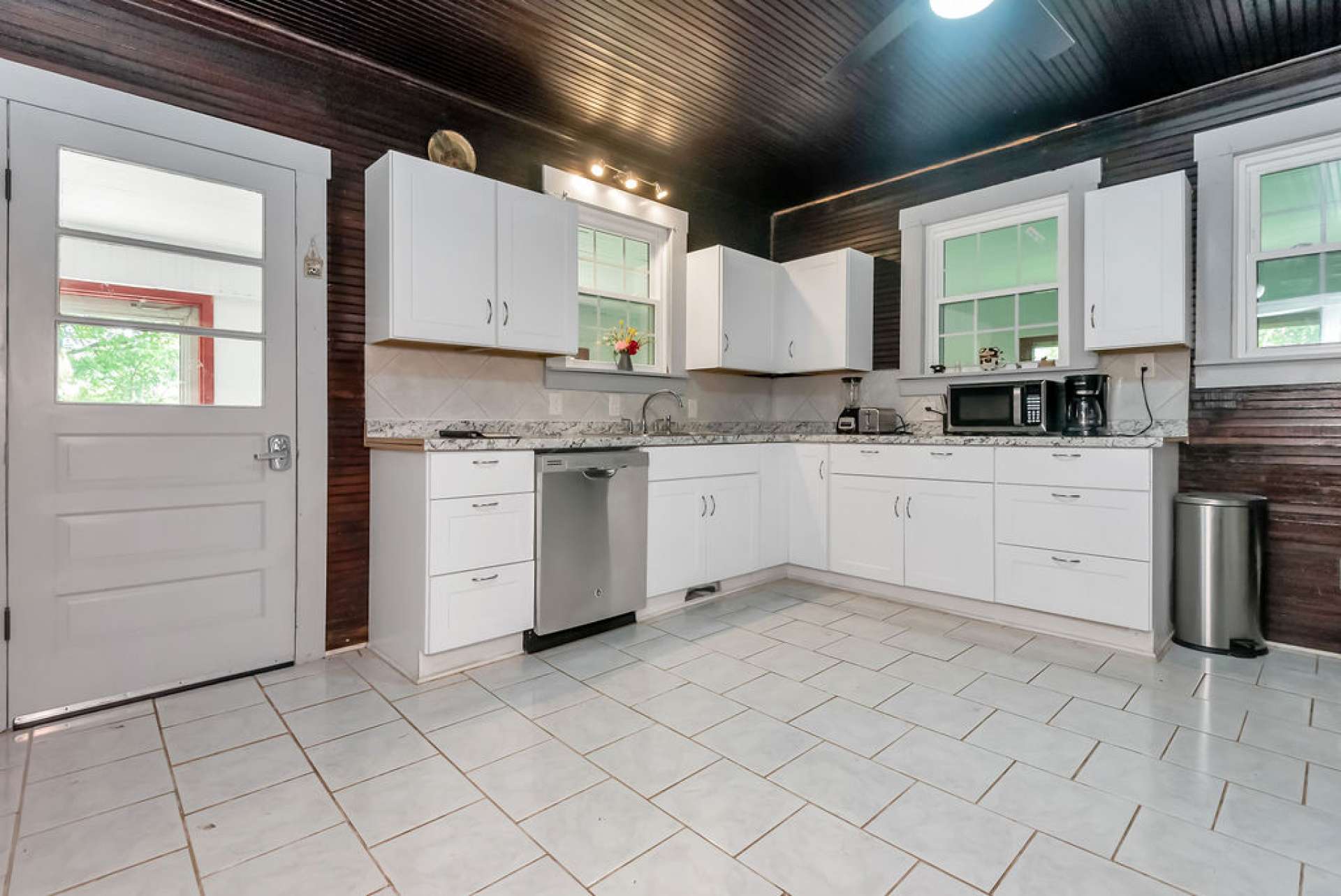 Renovated kitchen offers a modern flare.