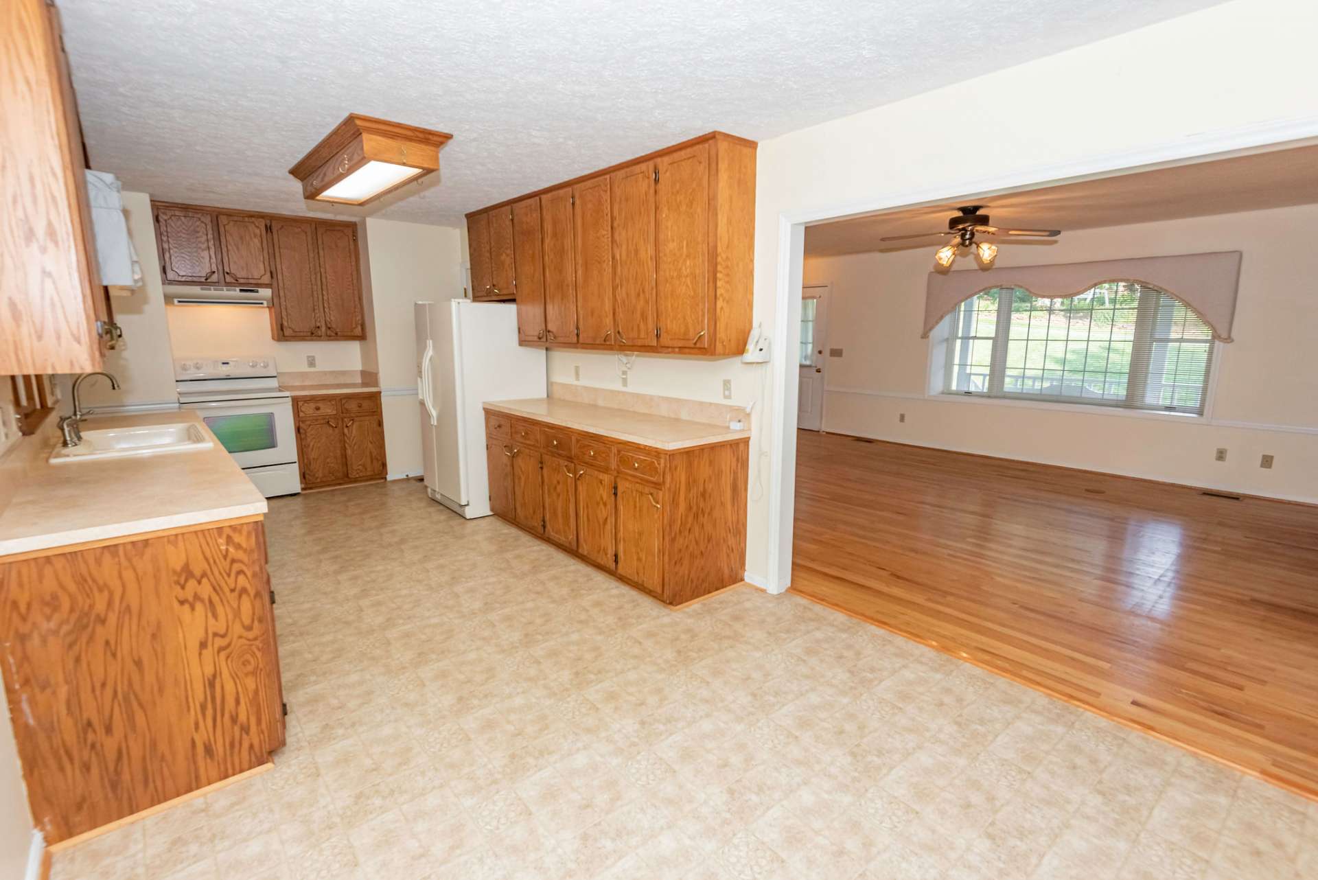 Open to the living area, the galley style kitchen offers plenty of work and storage space.