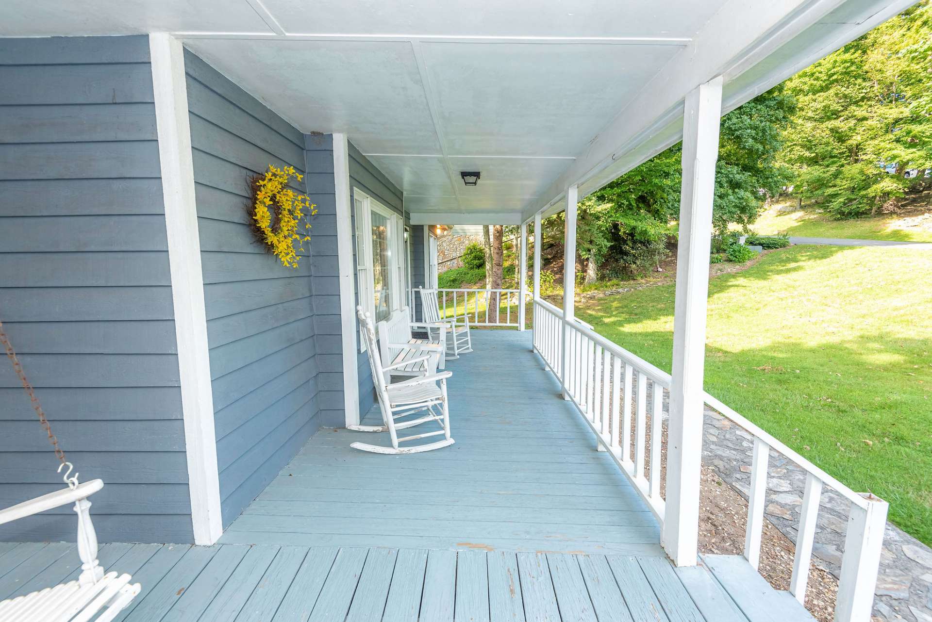 The covered wrap porch provides plenty of space for outdoor entertaining.