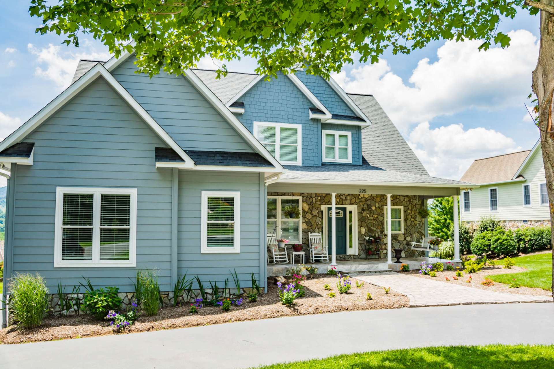 A paved drive directs you to the entrance and covered rocking chair front porch. What a wonderful place to greet your family and friends.