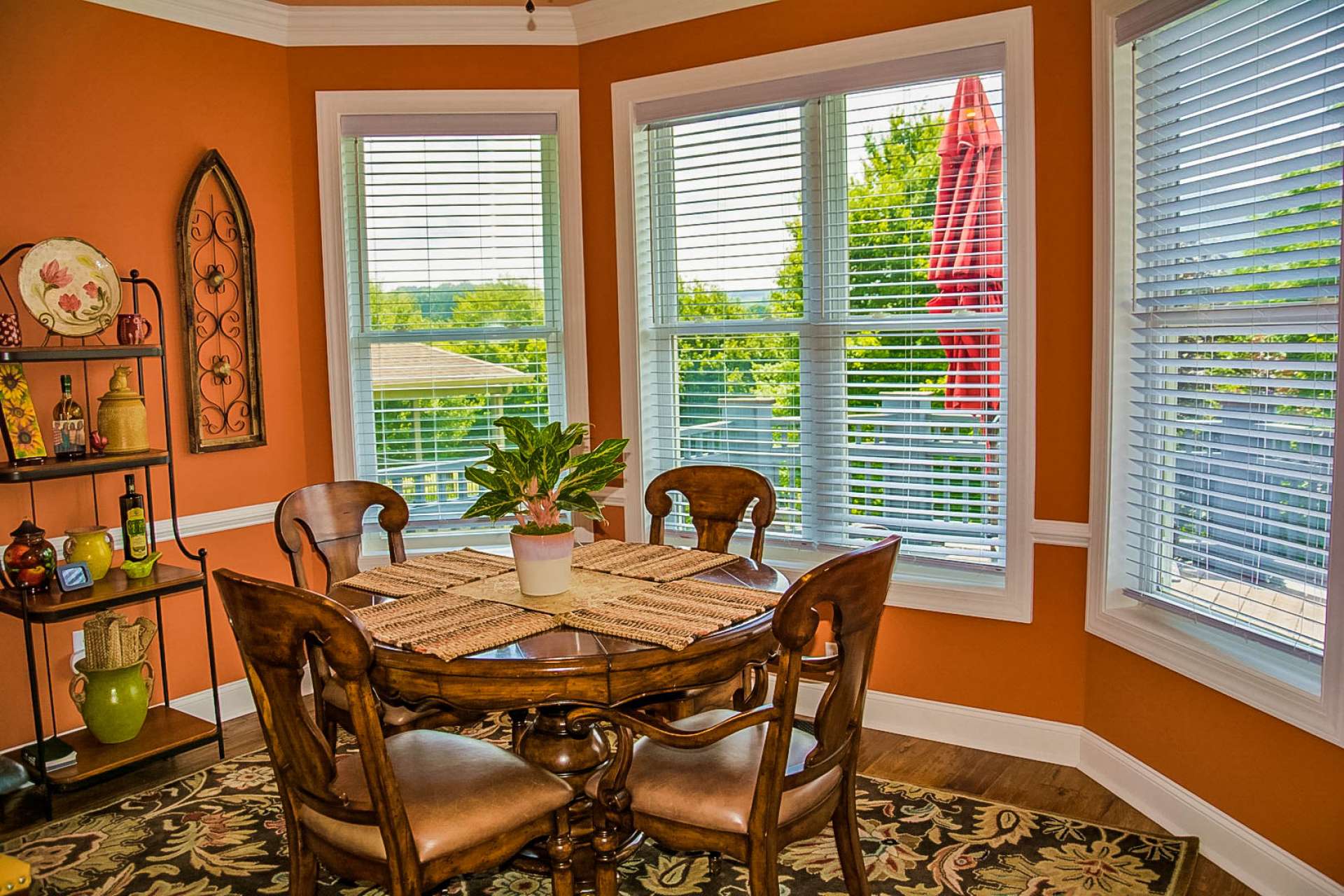 This cozy breakfast nook is located just off the kitchen and features lots of windows to enjoy the outdoor scenery from inside.