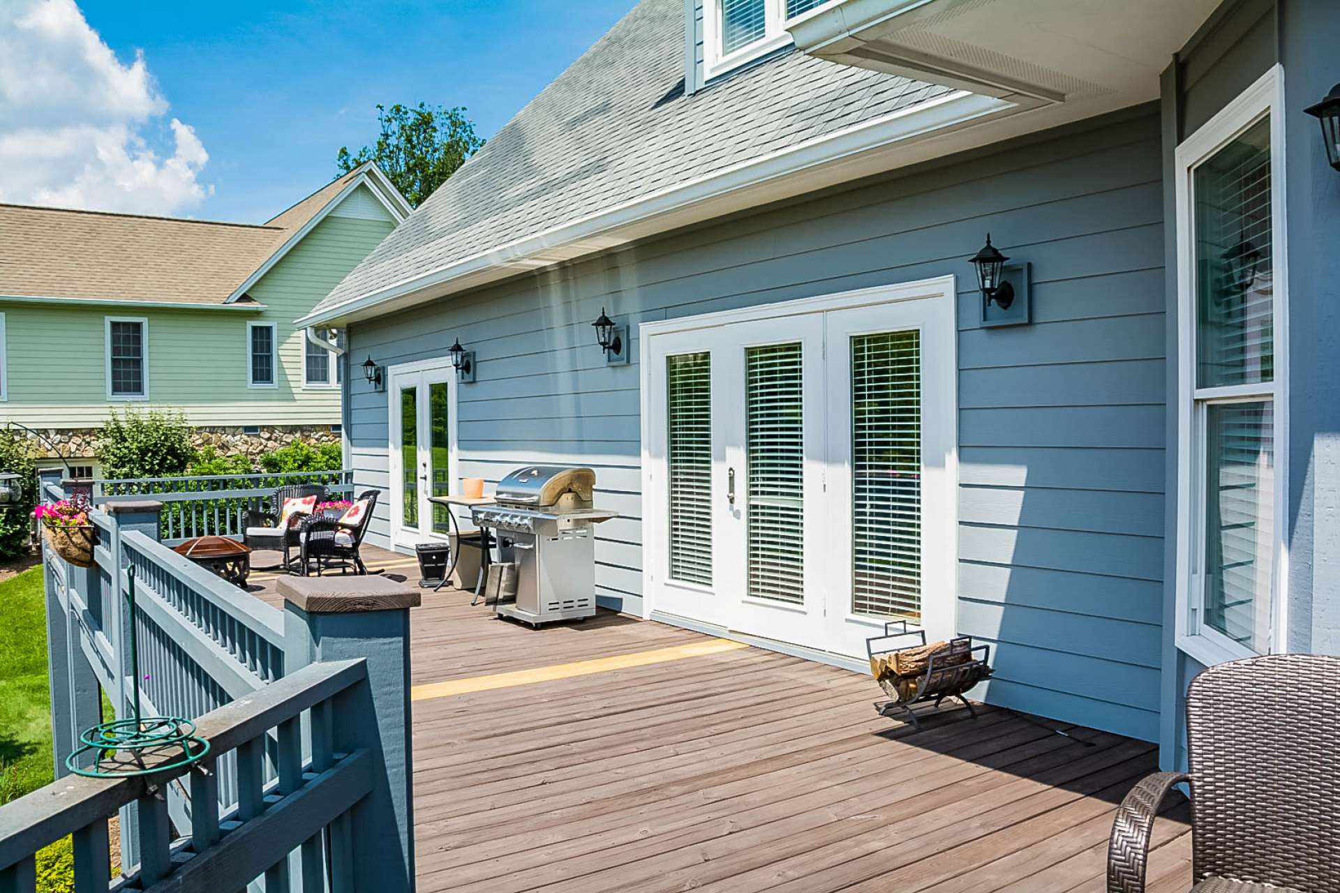 Relax with a tall glass of iced tea on the spacious open back deck that is perfect for outdoor entertaining.