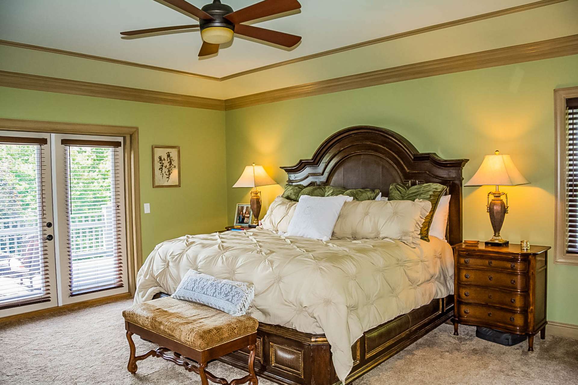 A lovely spacious main level master suite features private access to the back deck, and a luxurious private bath with air jet tub, tile shower, double vanity with vessel sinks and a walk-in closet.