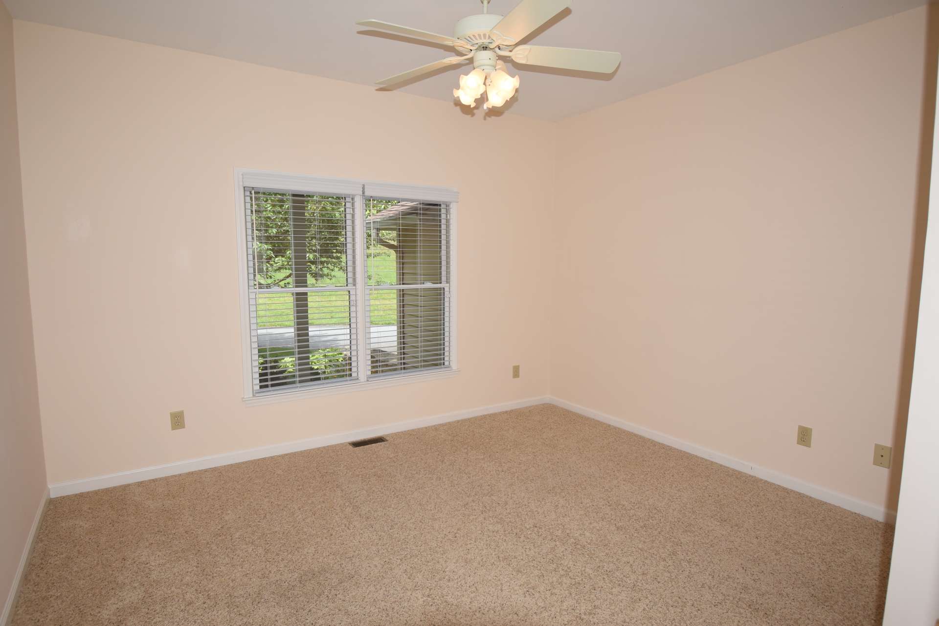 The second main level bedroom is  generously sized and offers a home office option. A dedicated laundry room and the 2-car attached garage complete the main level.
