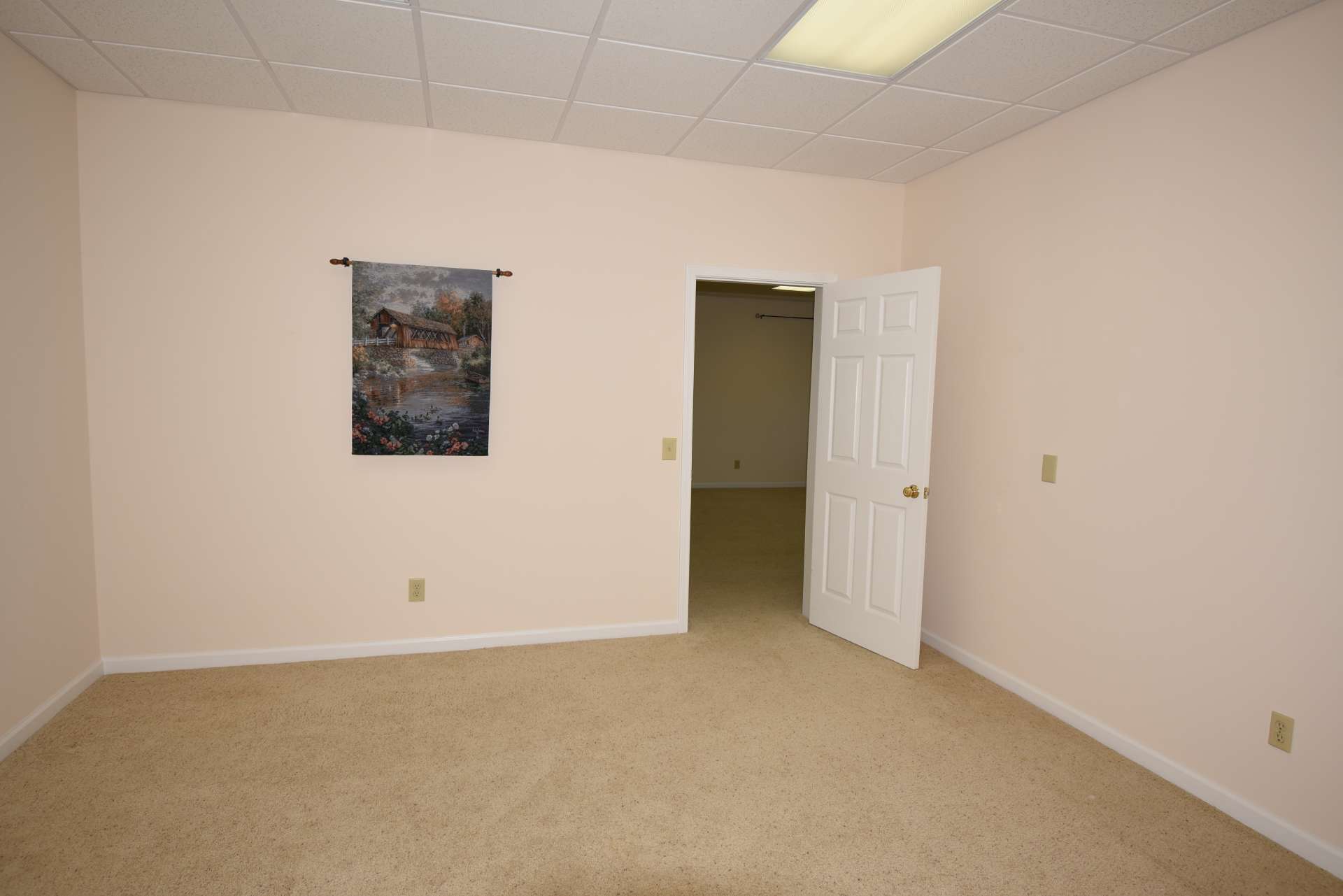This charming bonus room is currently used as additional sleeping space.