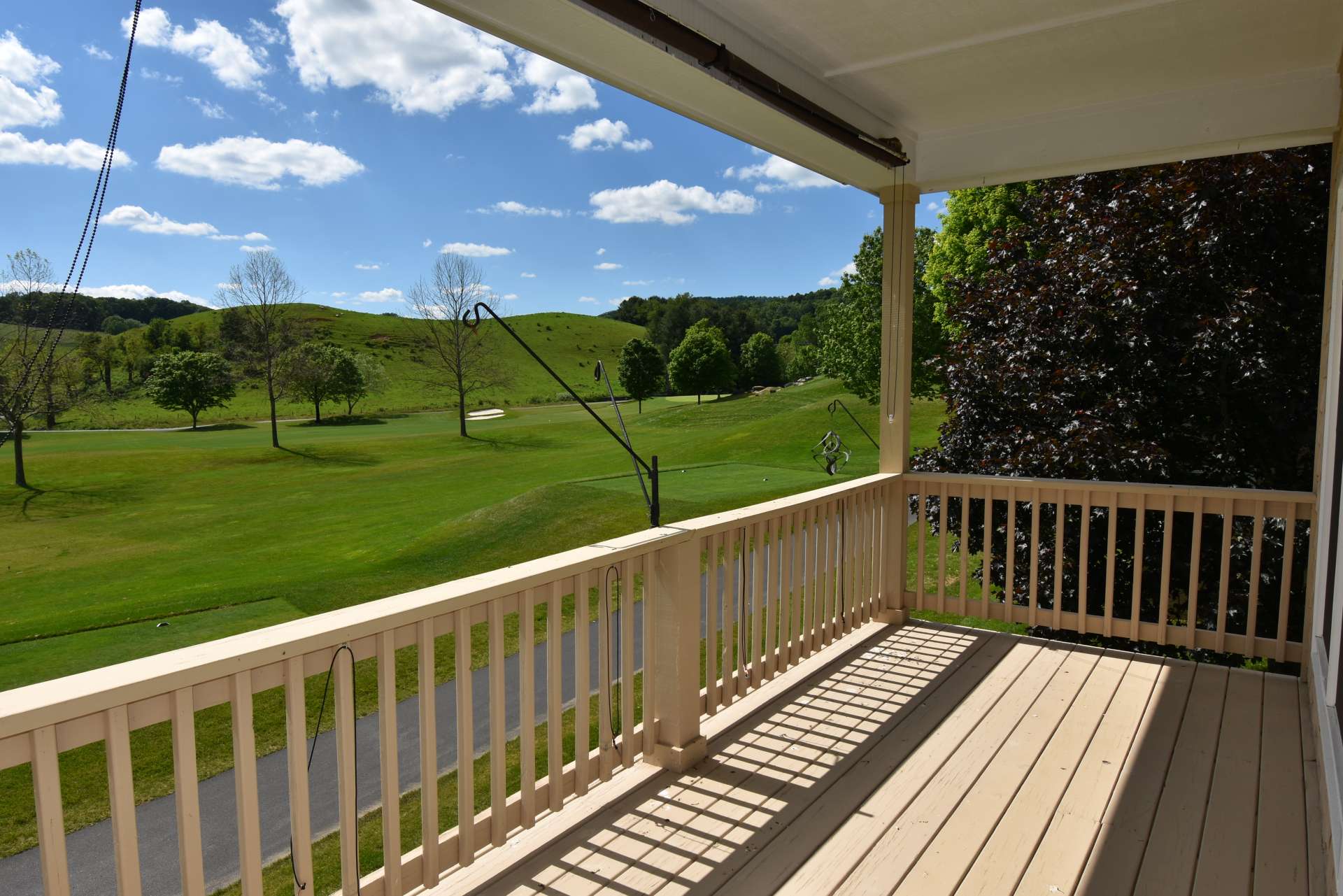 The main level also features a partially covered deck for outdoor entertaining with the fairway and mountain views.