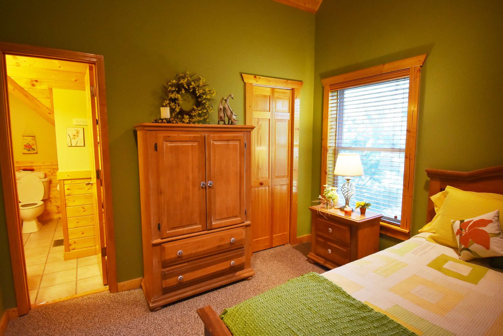 The second bedroom is located on the upper level and features an en-suite full bath.