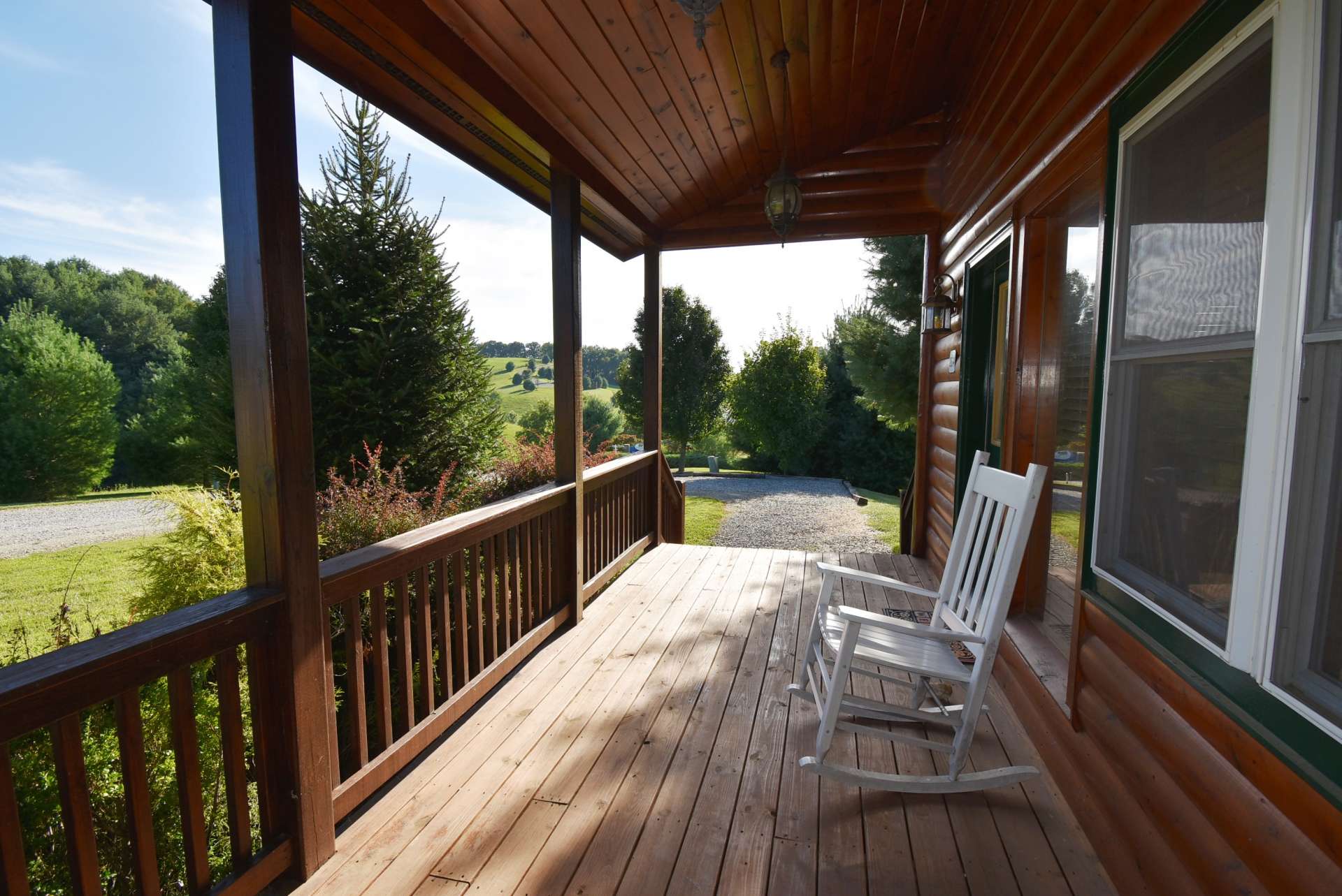 A rocking chair covered front porch is a relaxing way to spend a warm summer afternoon.