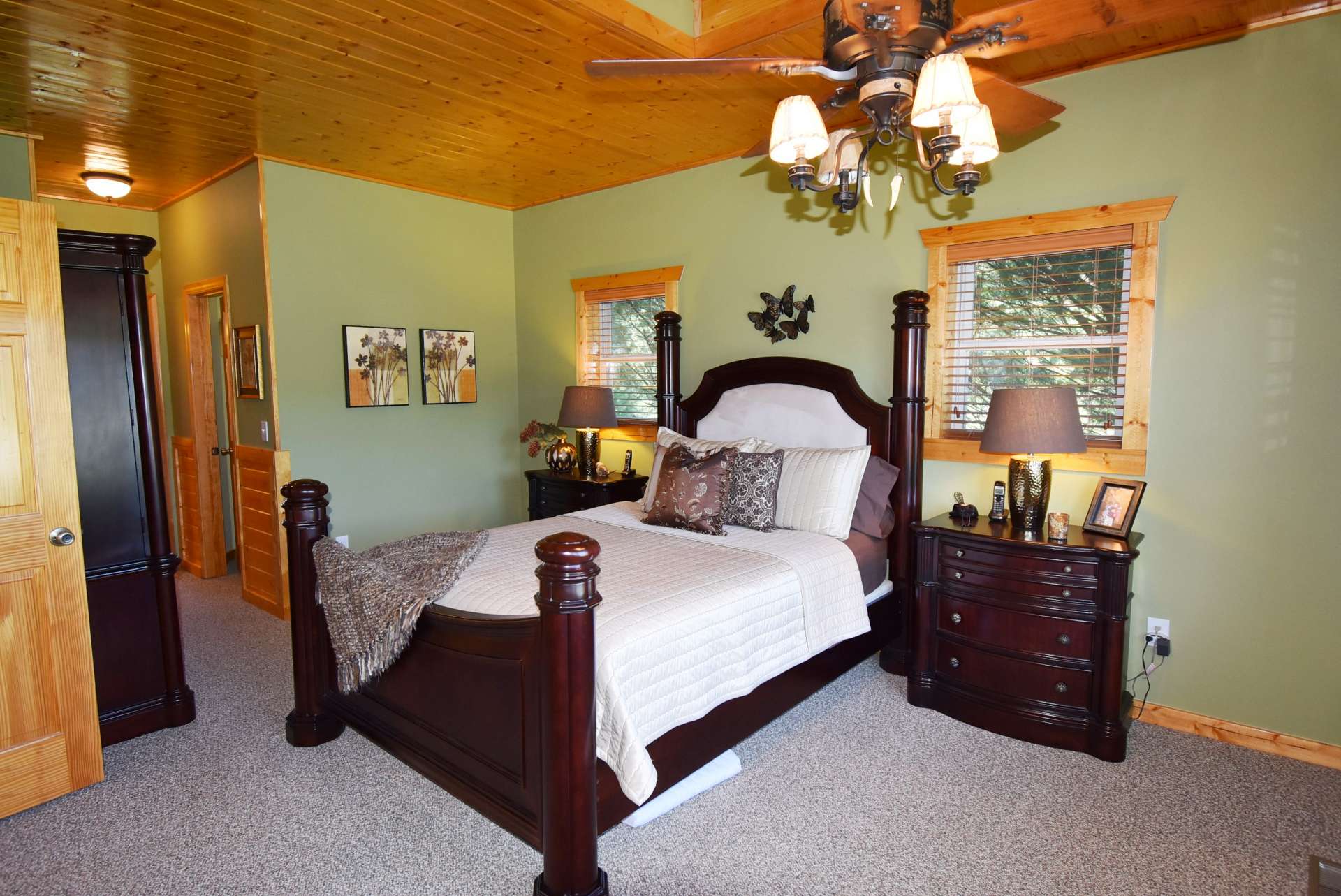 The main level master suite features vaulted ceiling, plenty of windows, and a private bath.