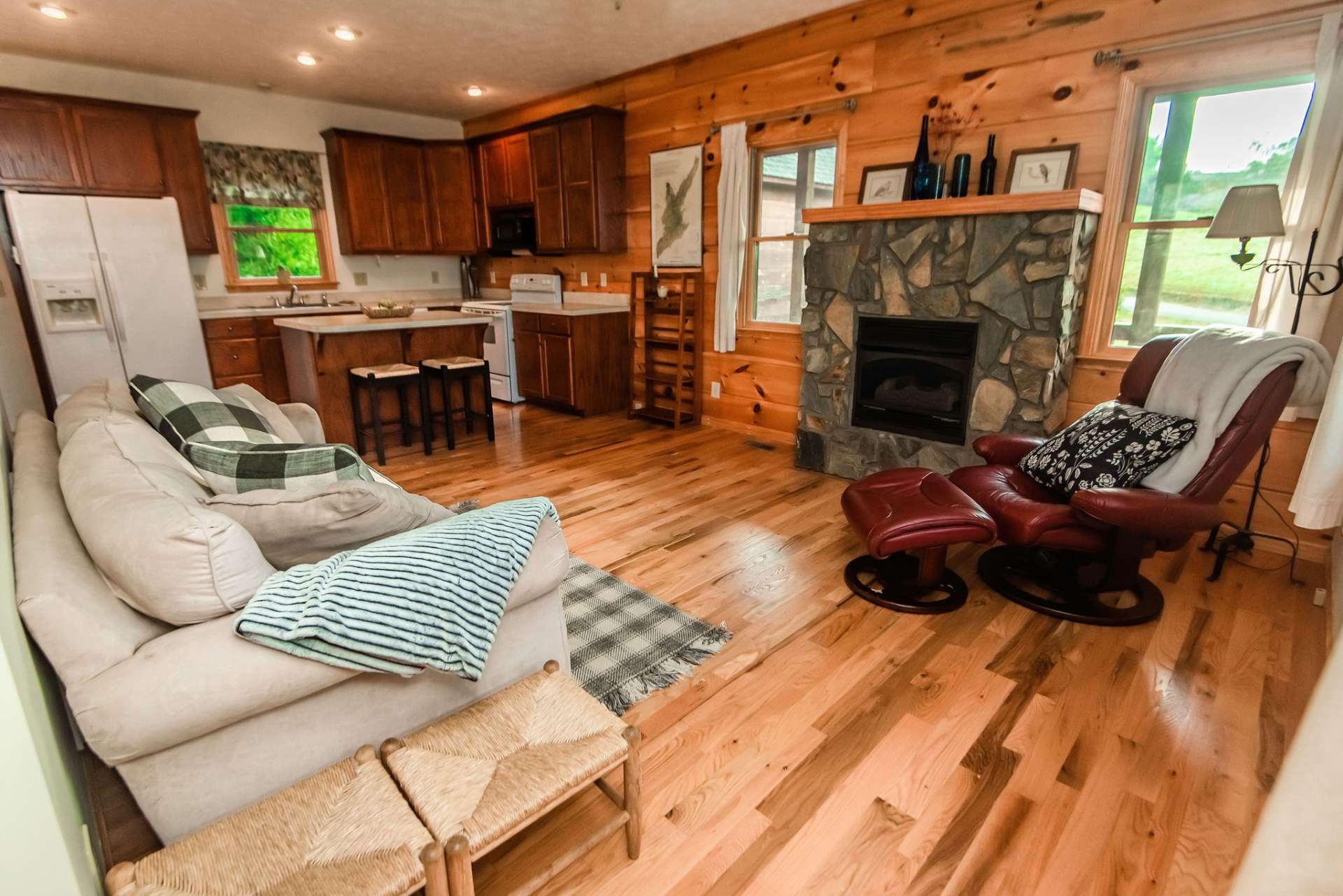 The open flow from the living area to the kitchen and living area provides for easy transition when entertaining and allows the host or hostess to stay involved during conversation.