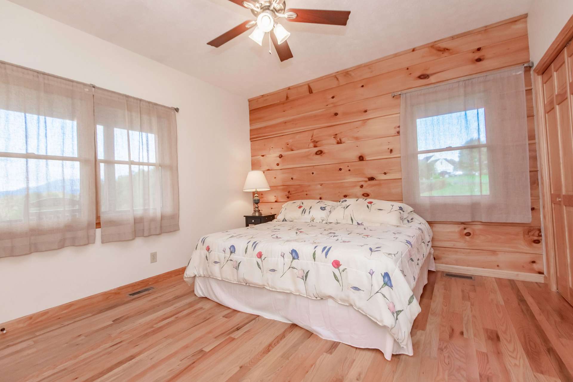 A light filled main level master suite includes a private bath.