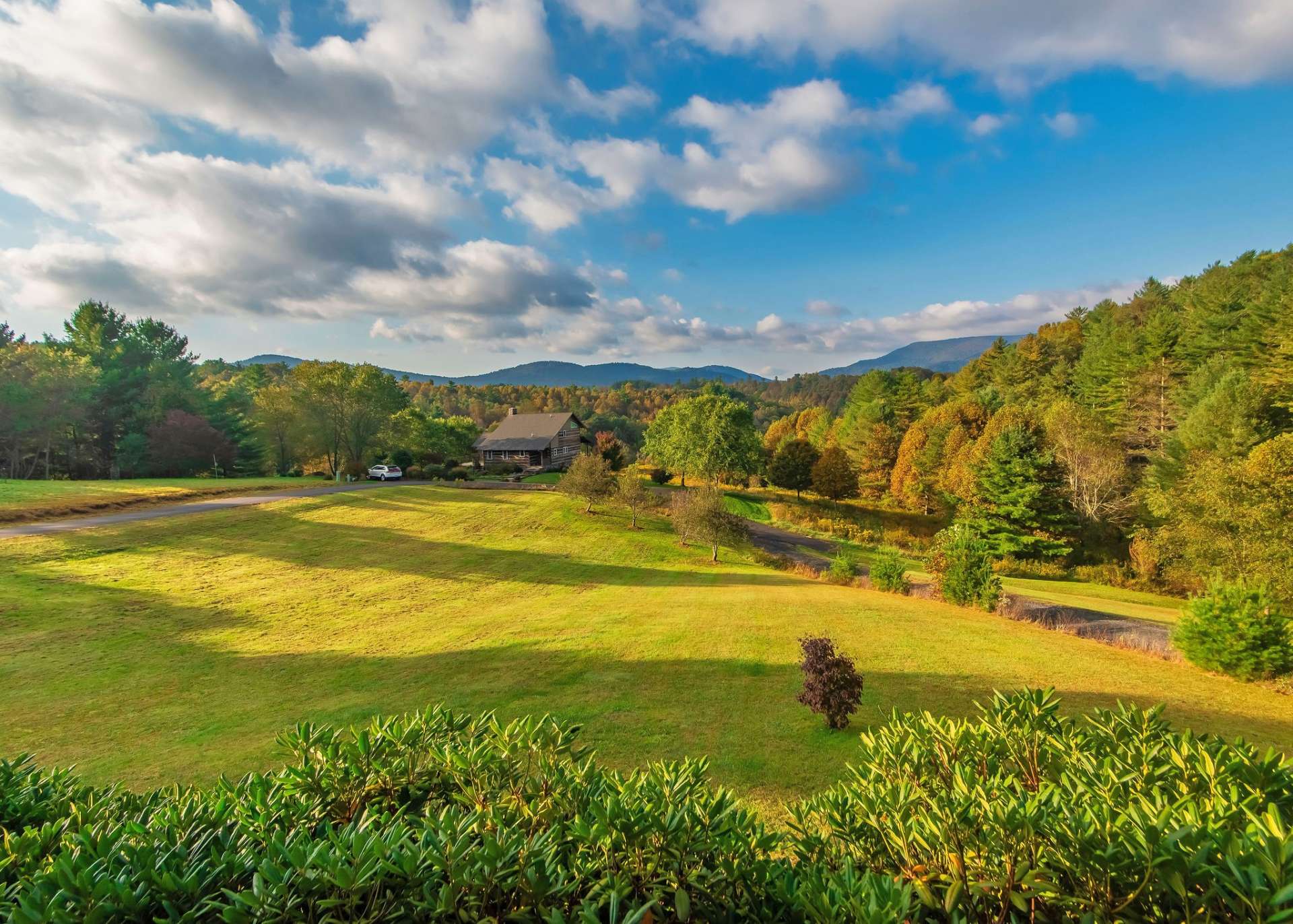 Enjoy peaceful mountain surroundings and long range views from the covered rocking chair front porch.