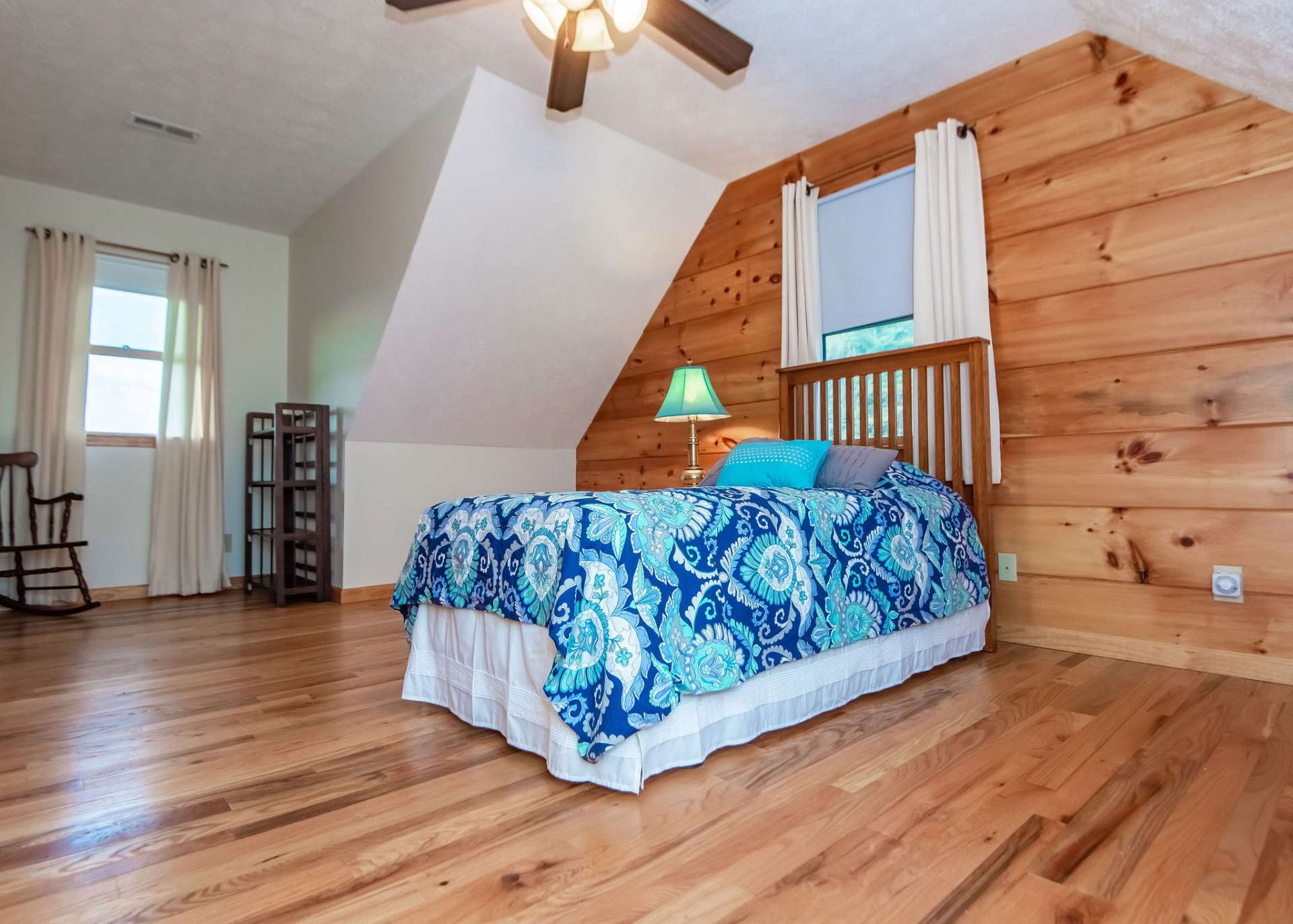 The upper level features two guest bedrooms and a full bath.