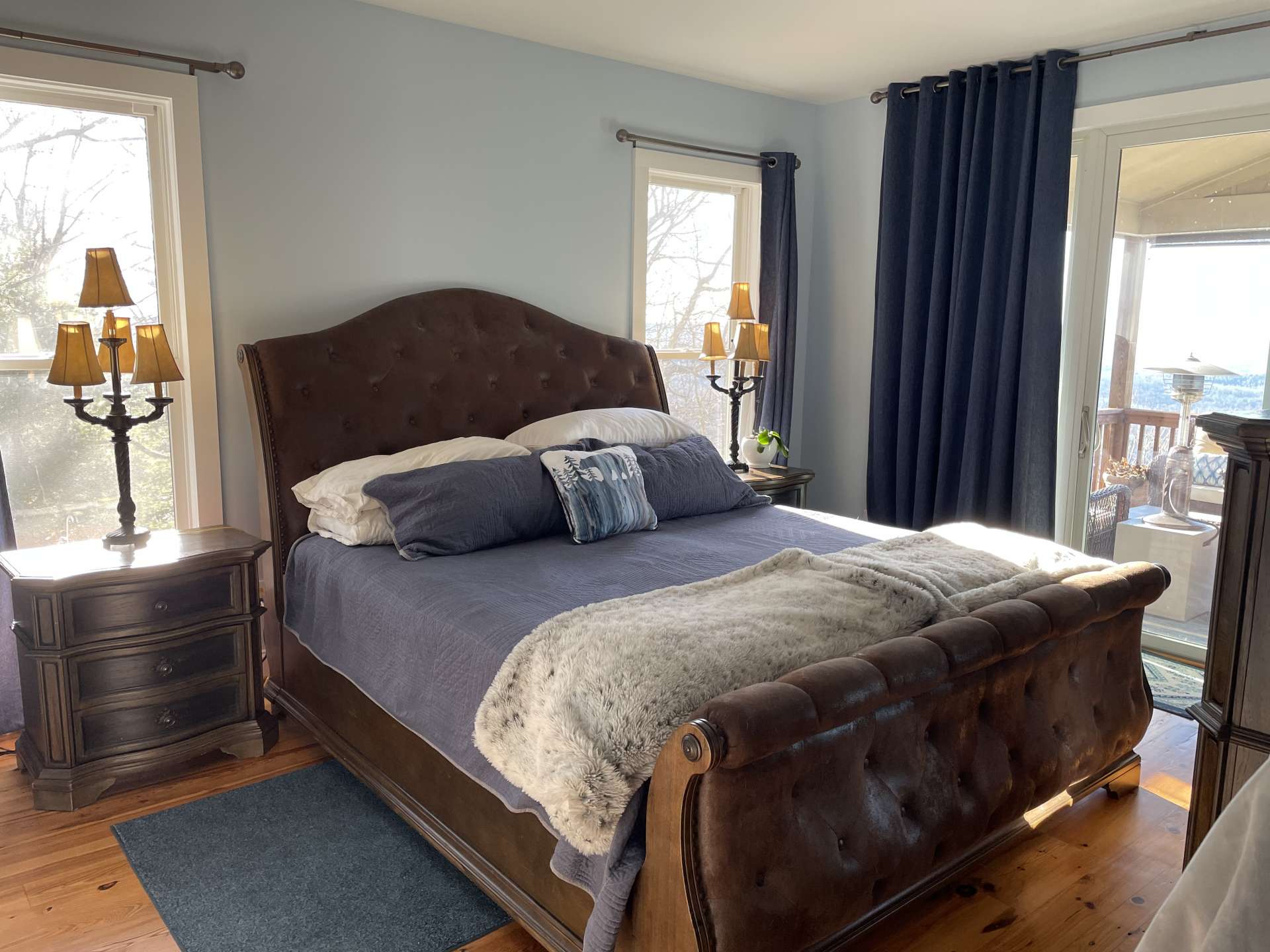 Primary bedroom with a view and covered deck access.