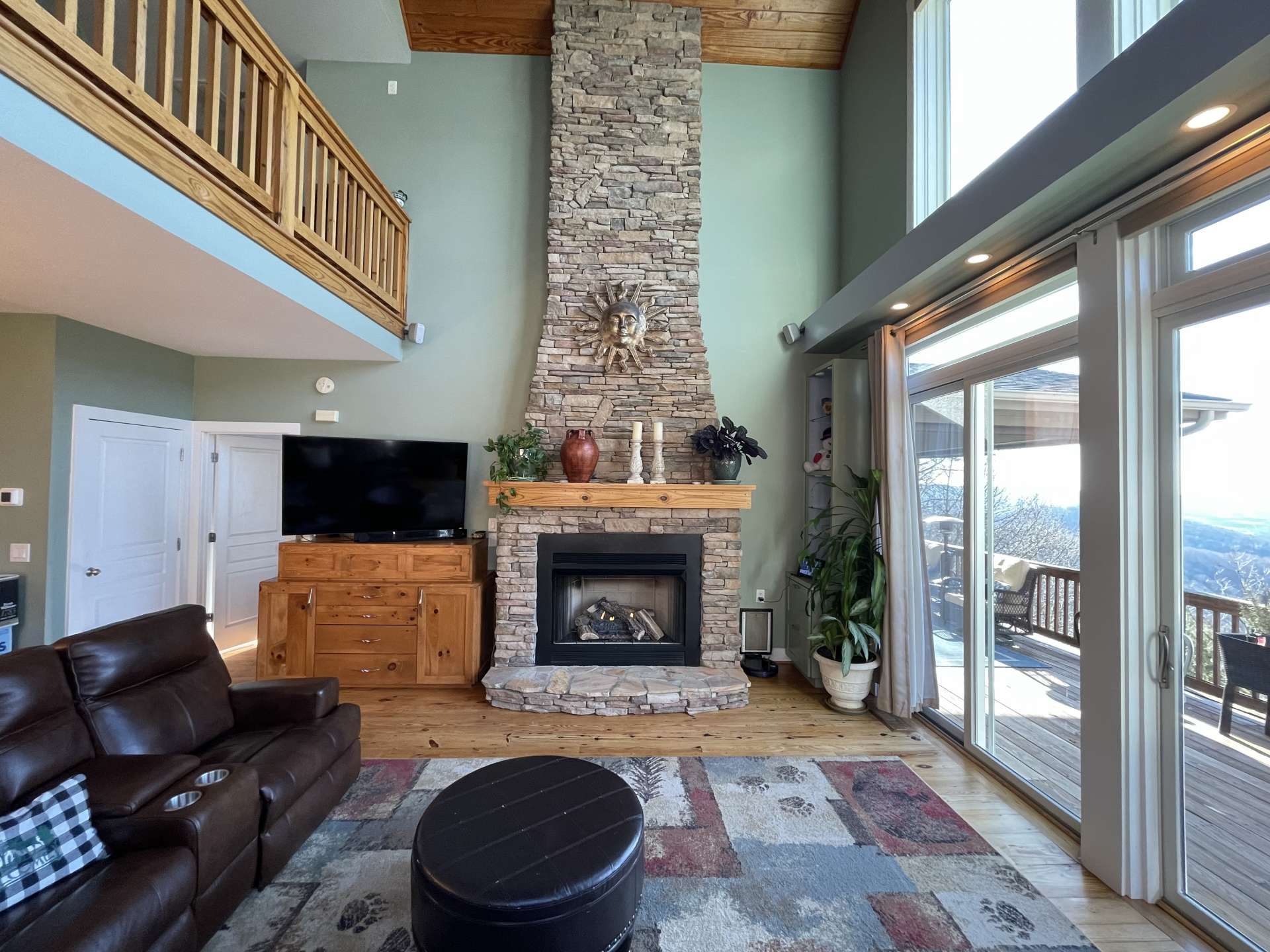 Floor to ceiling stone fireplace.