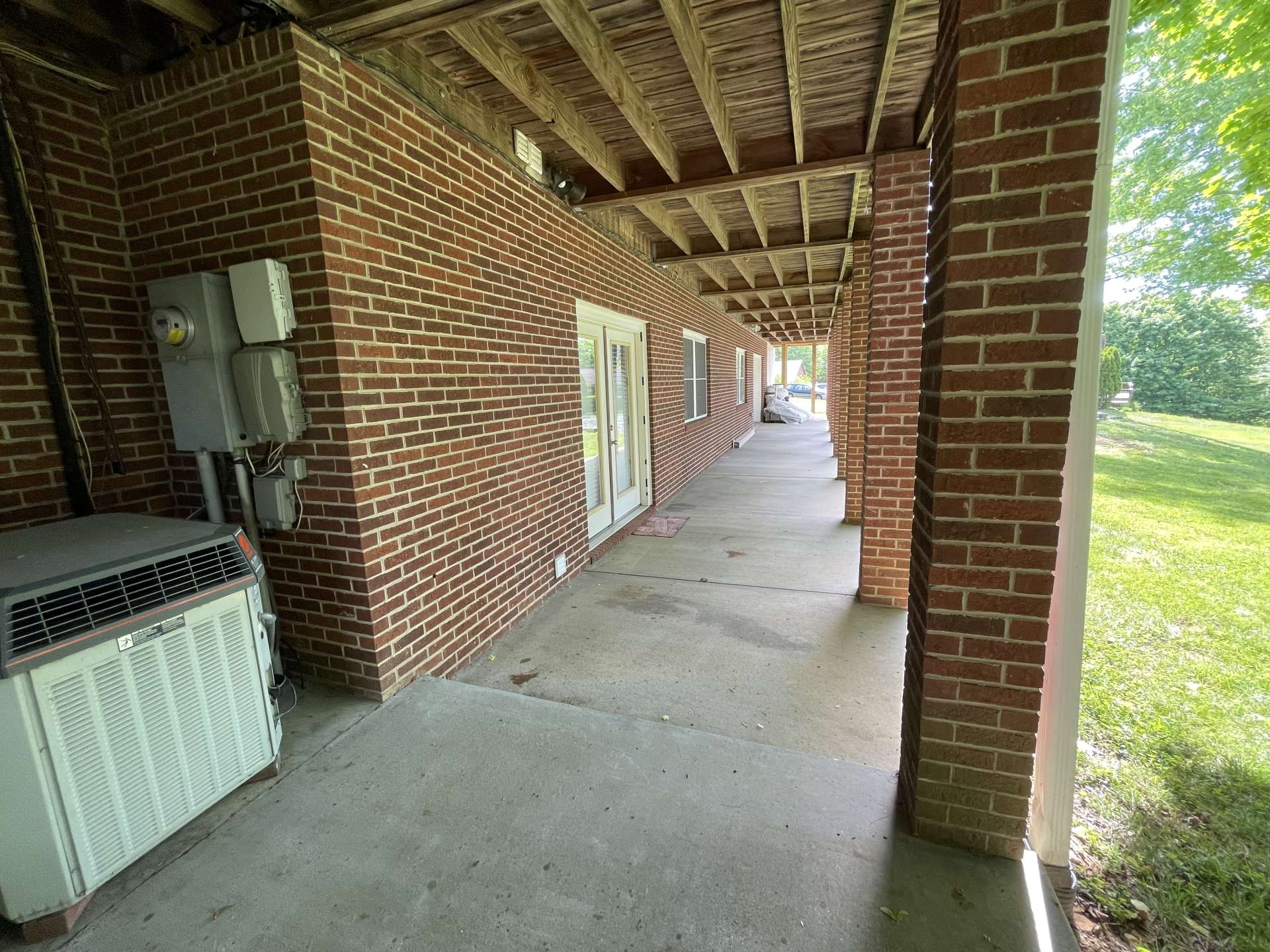 Lower-level patio and access to a beautiful backyard.