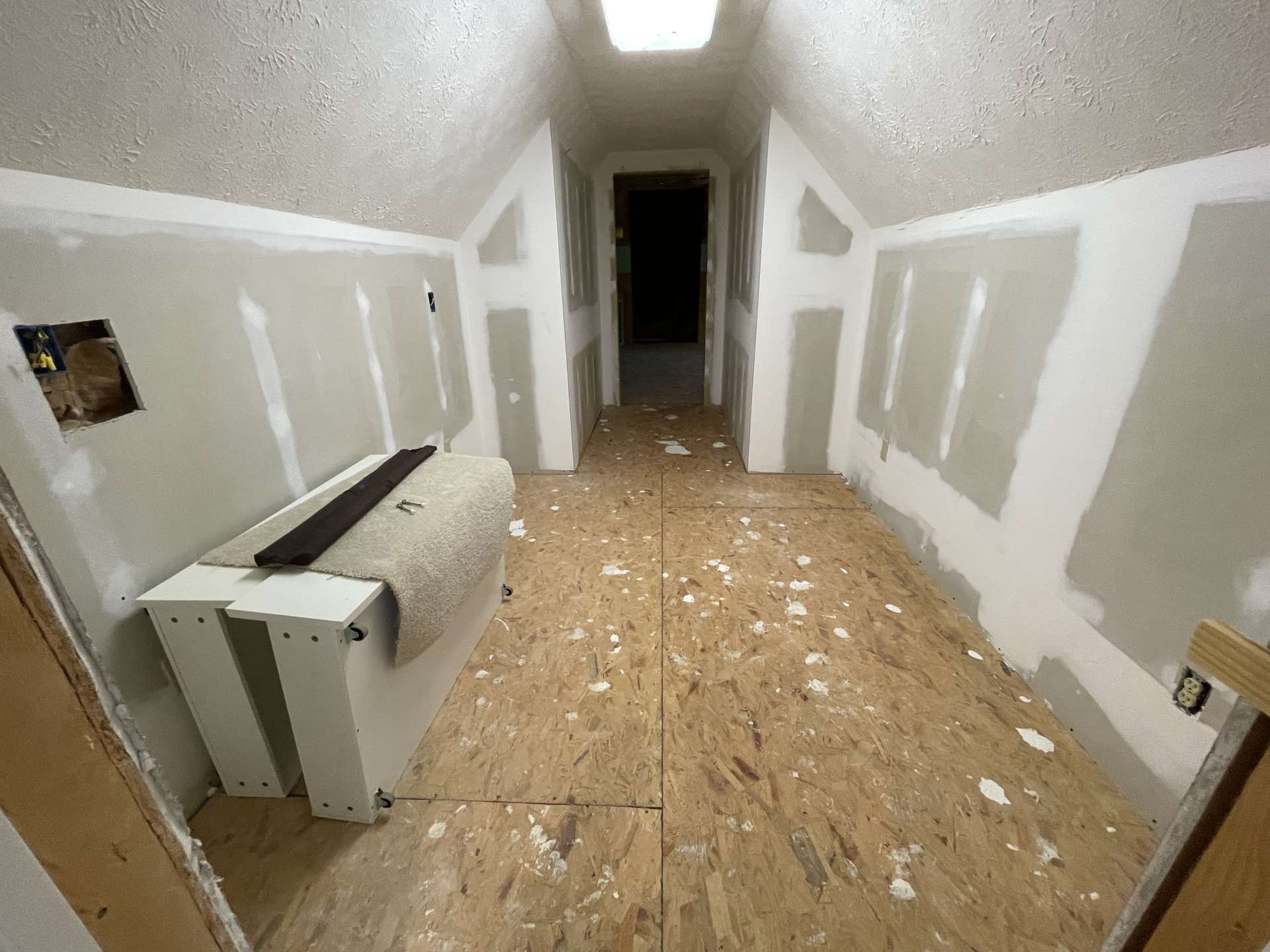 Upper-level unfinished space awaiting your finish options or use as storage space