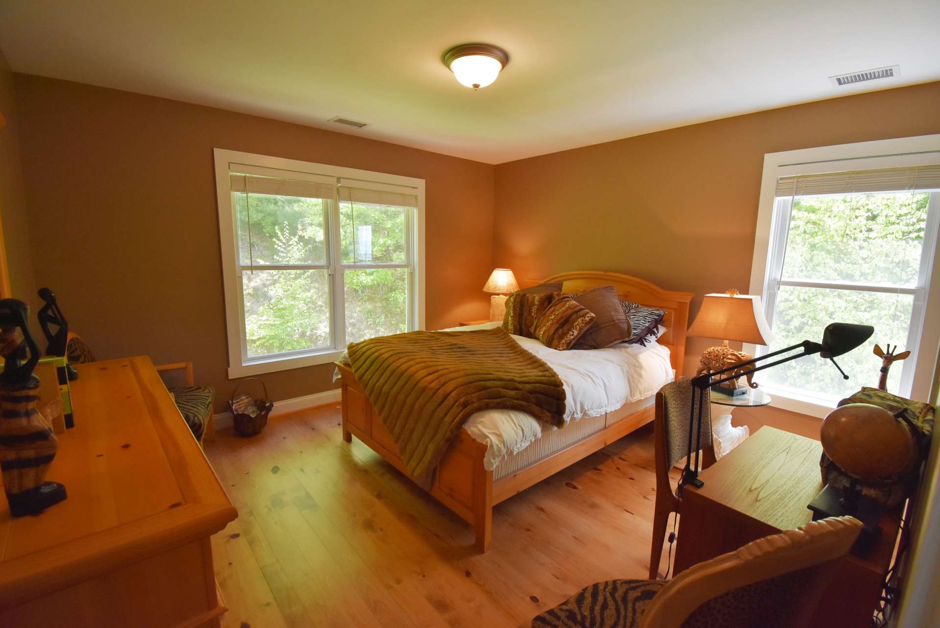 The upper level also offers two guest bedrooms, a bonus room, and a full bath.