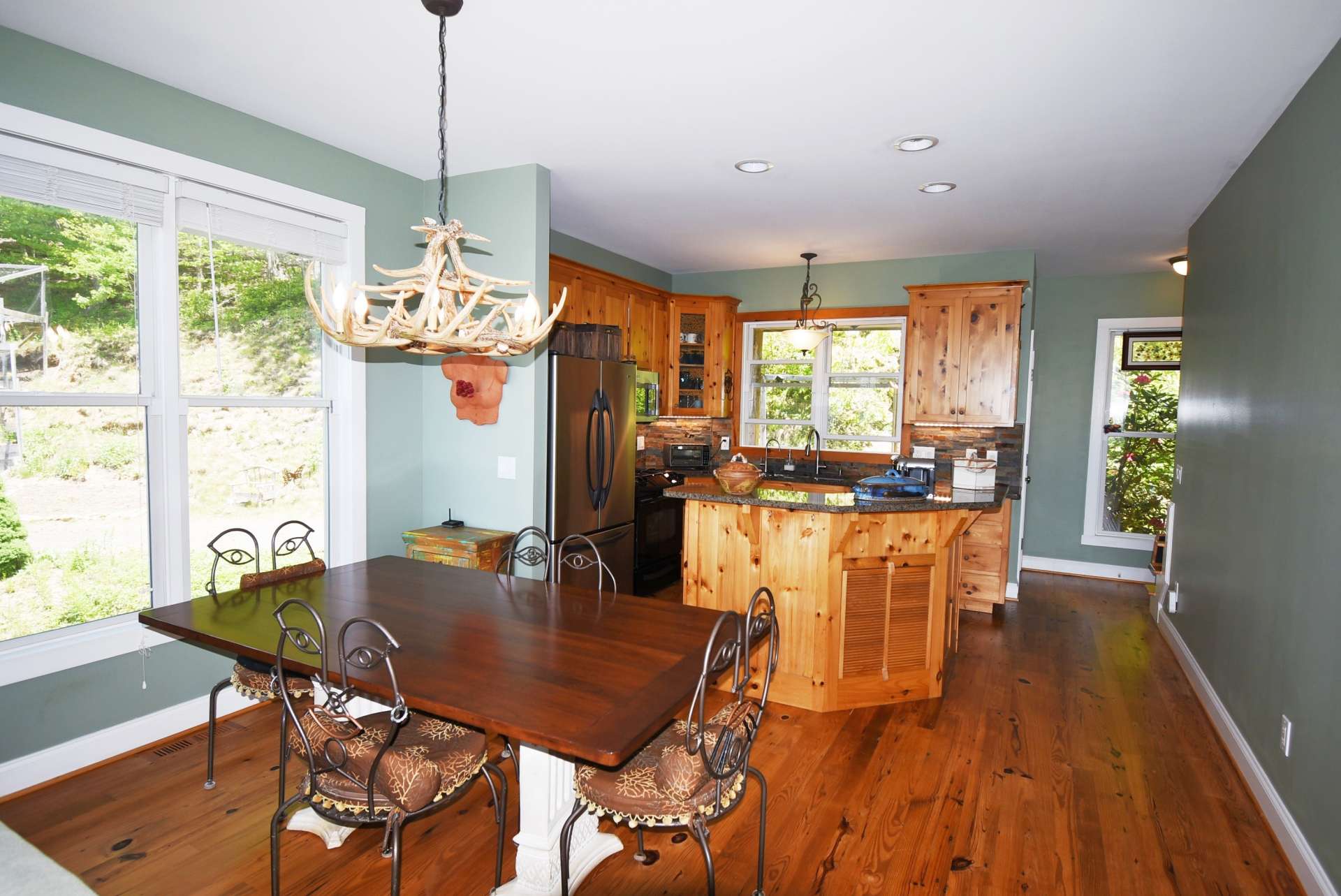 The formal dining area is central to the kitchen and living areas and also takes advantage of the views while dining inside.