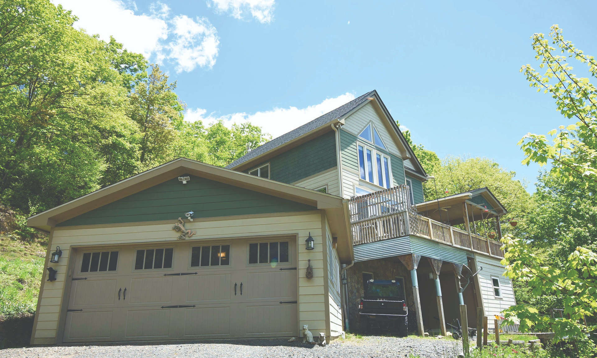 Perfectly situated on a beautiful wooded 5.86 acre setting in Noah's Ridge located in Fleetwood just minutes to Boone and West Jefferson, this Blue Ridge Mountain home with 3-bedrooms, 2.5-baths, bonus/media room, wood floors, native stone floor to ceiling fireplace with gas logs, garage, large partially covered deck and gorgeous layered long range views is offered $539,000. This home and location is ideal for a mountain retreat or for full-time living. S170