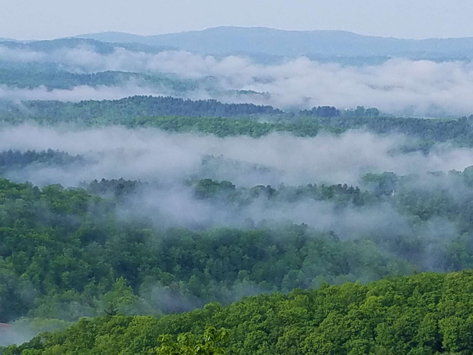 This seller provided photo gives you a close-up of the view and details the many layers of mountain vistas.