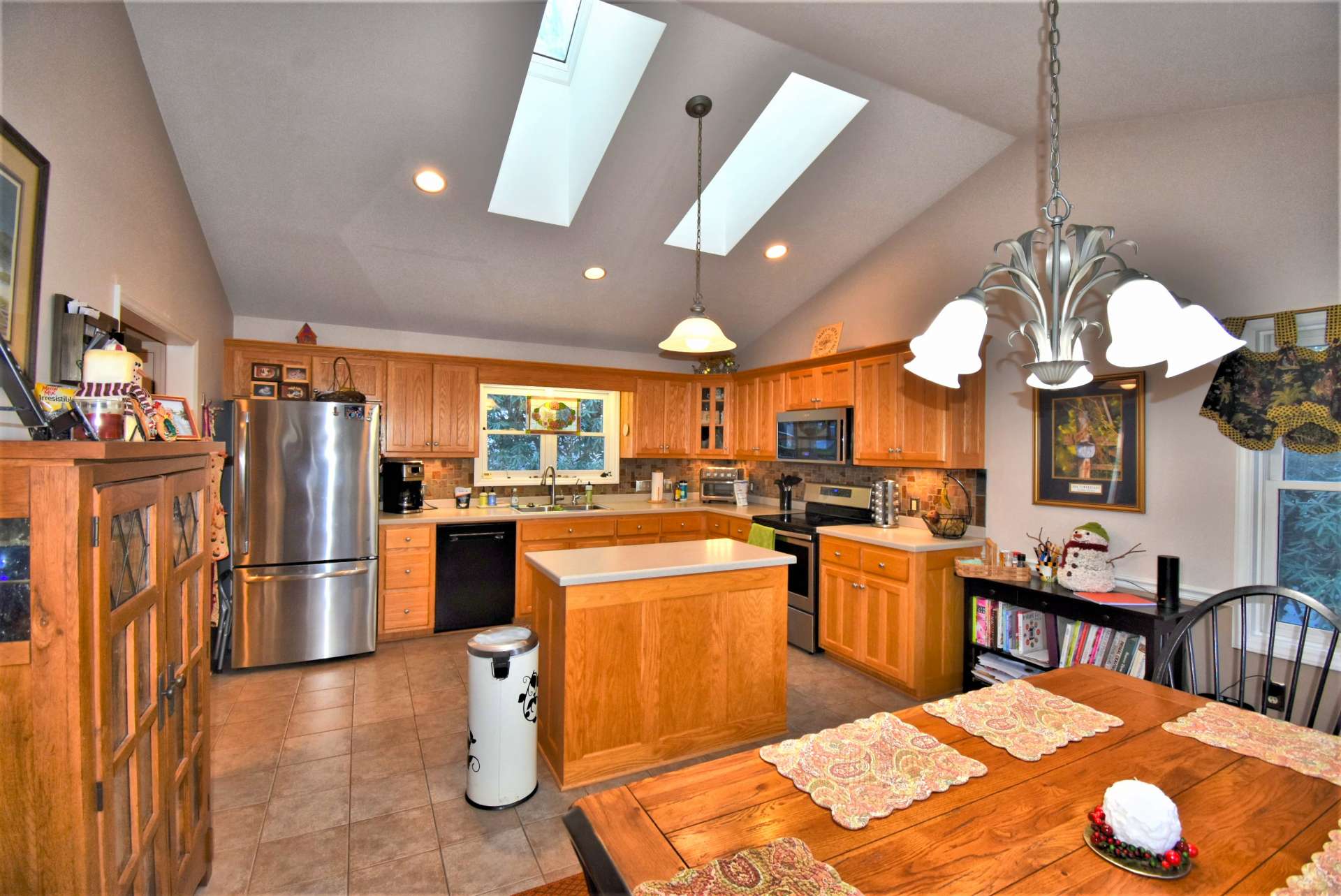 Skylights in the large kitchen area keep this space nice and bright.