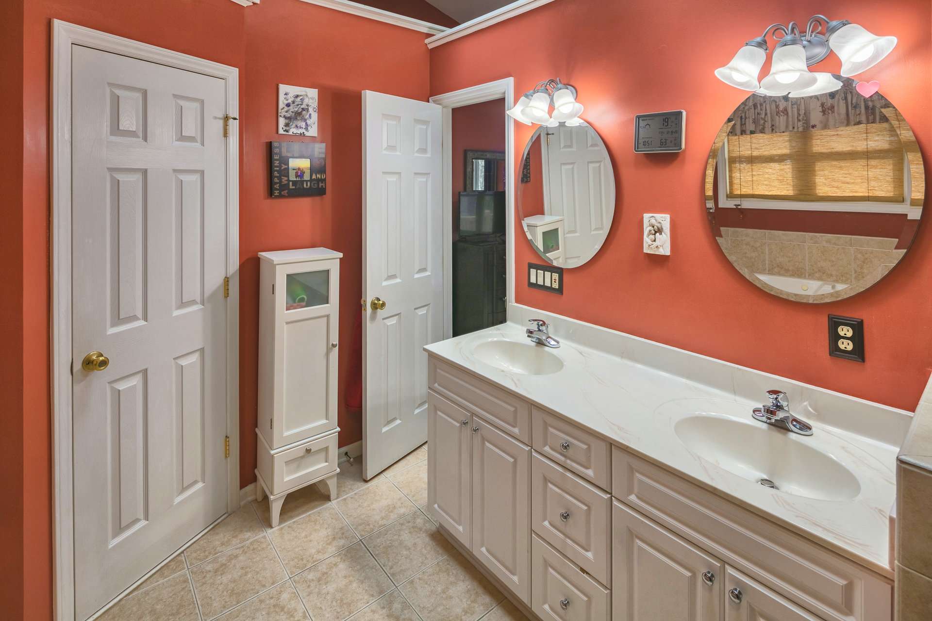 The master bath features a double vanity, walk-in shower, and a jetted tub.