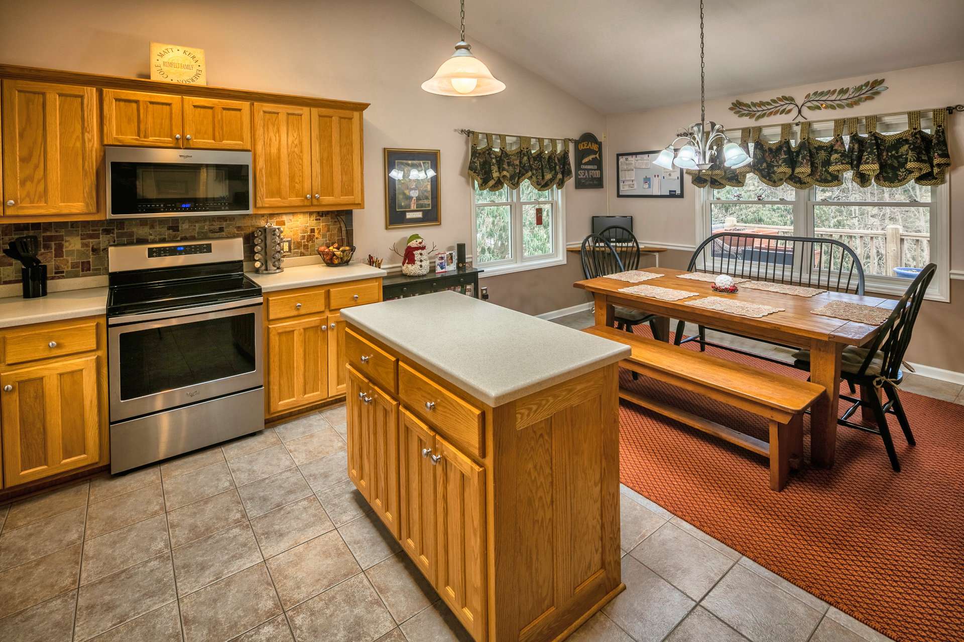 The dining area is open to the kitchen and living area and offers lots of windows to enjoy the outdoor scenery through all four seasons in the North Carolina Mountains.