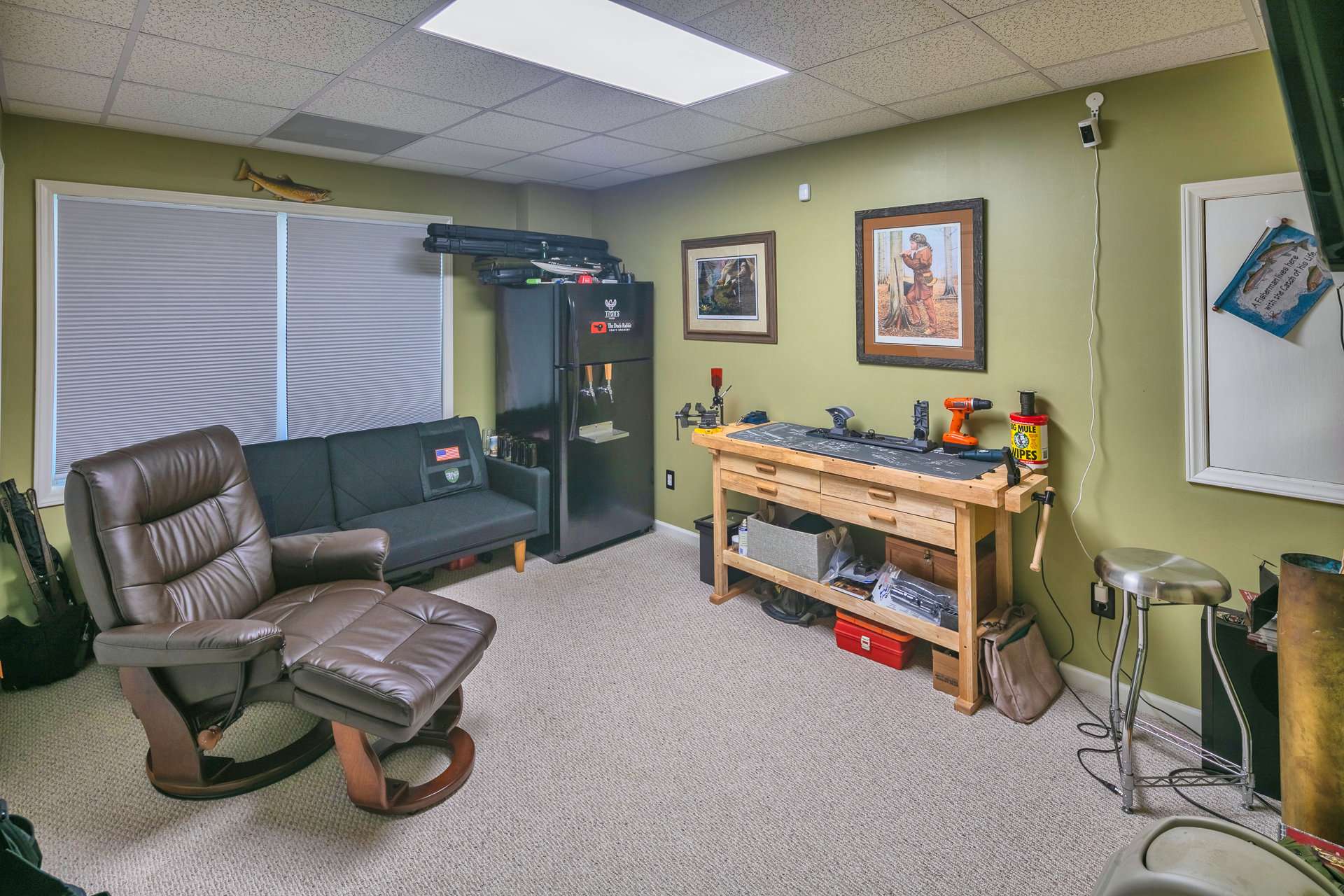 This lower level bonus room is ideal for hobby/crafting room, office, or additional sleeping space. The double doors access the garage area.