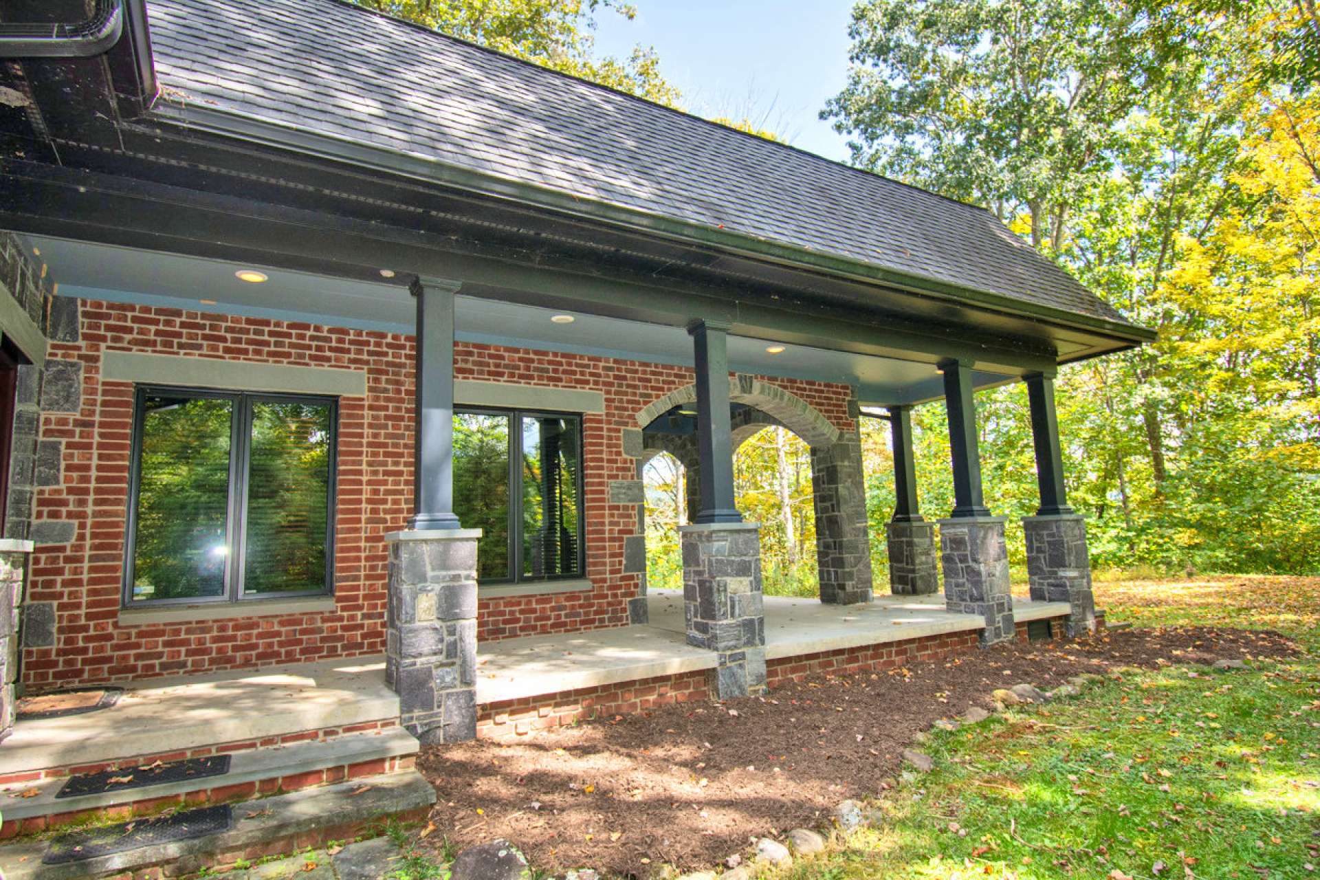 Covered wrap-around concrete patio for your outdoor dining.