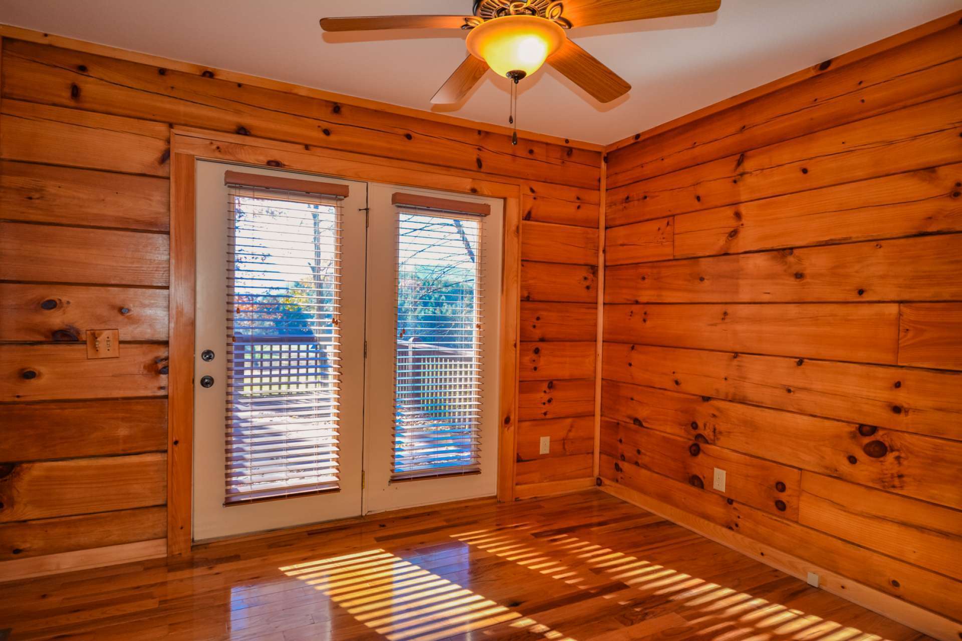 The main level master suite features a private bath and access to the back deck. French doors in the master bedroom gives private access to the outdoors.