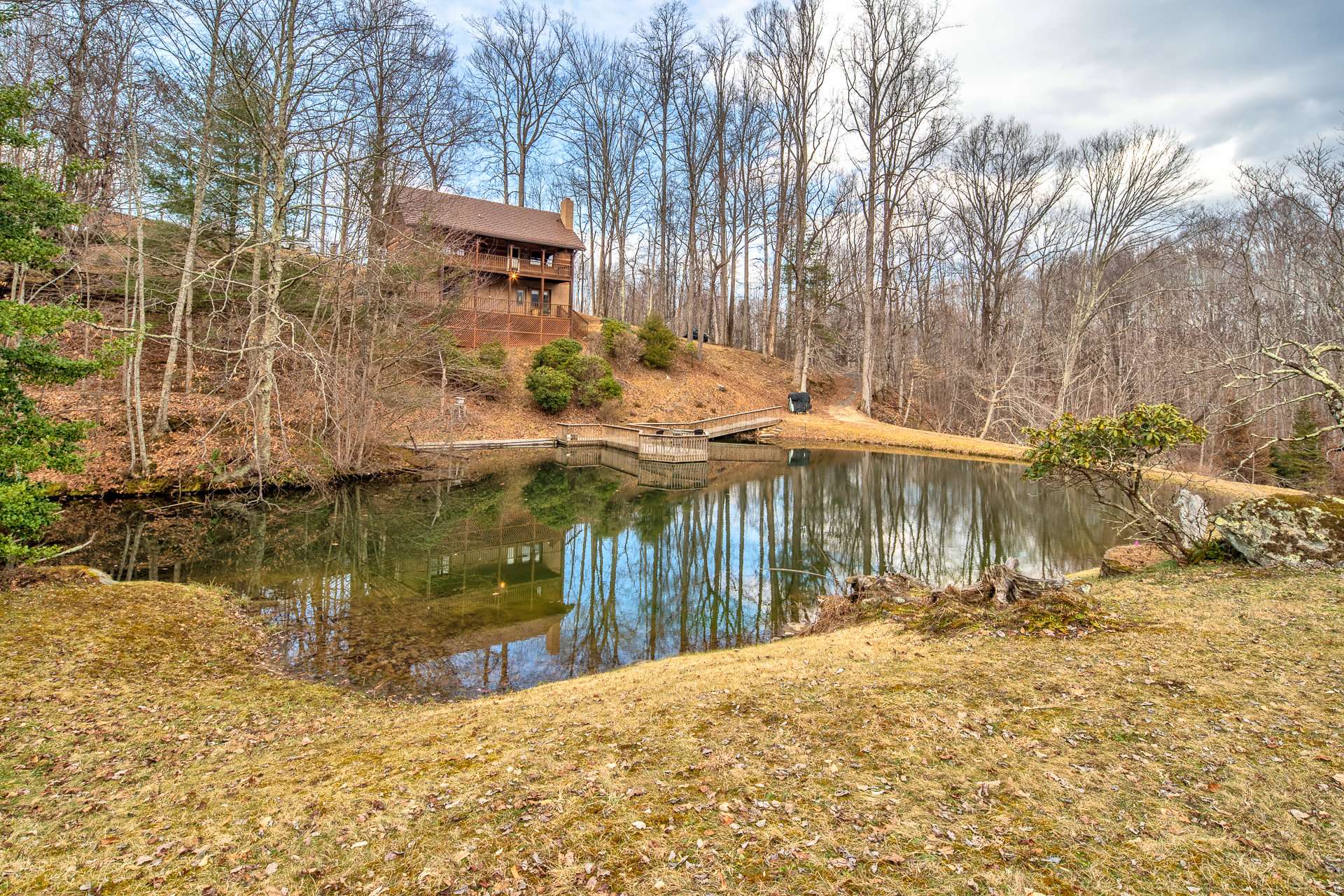 There are two levels of decking overlooking the pond and providing plenty of space for outdoor dining and relaxation.