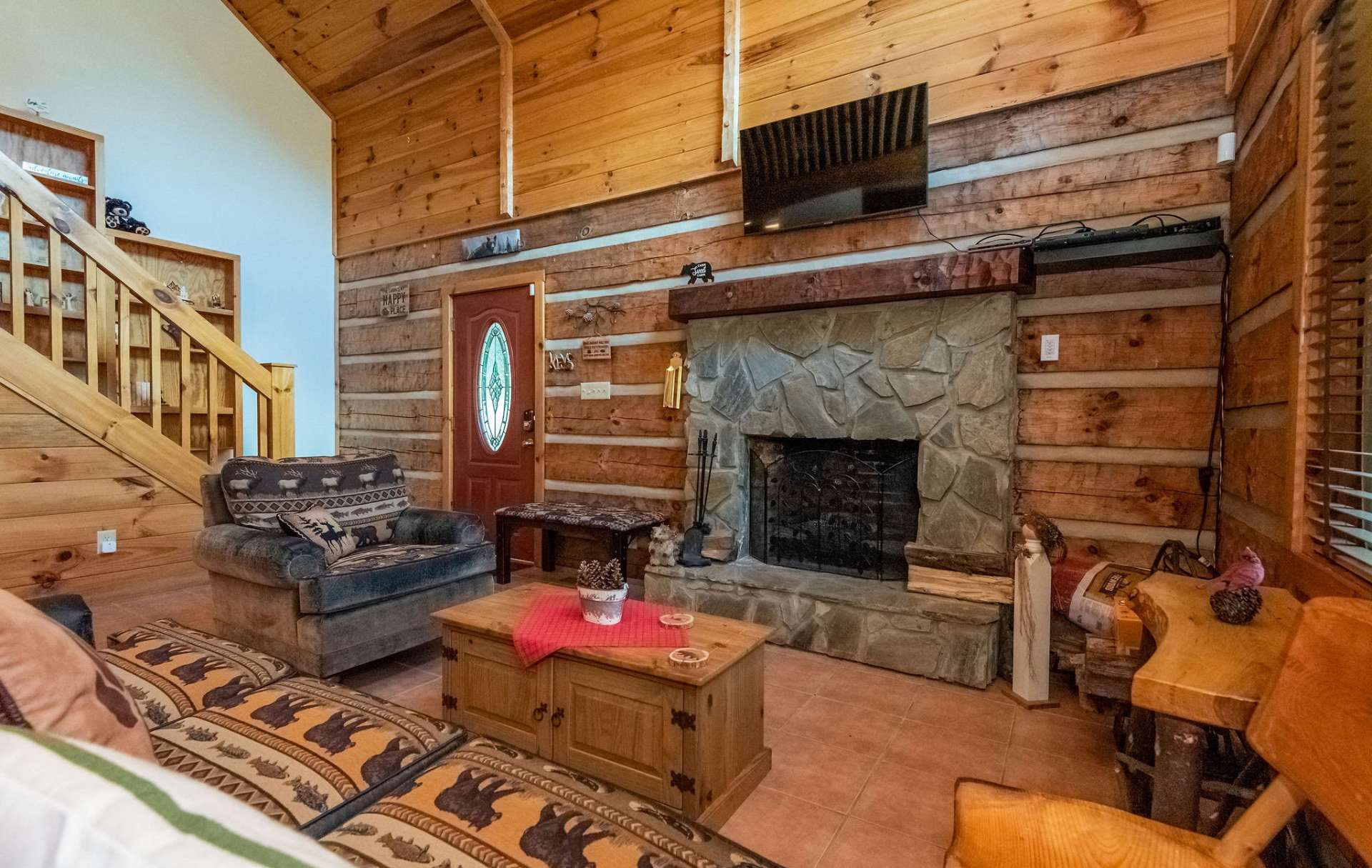 The gas log fireplace will brighten and warm the cool evenings in the mountains.