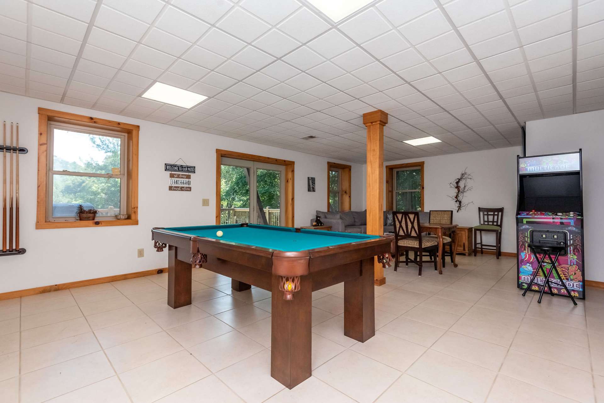 All your guests will love to hang in your game room leading to the deck.