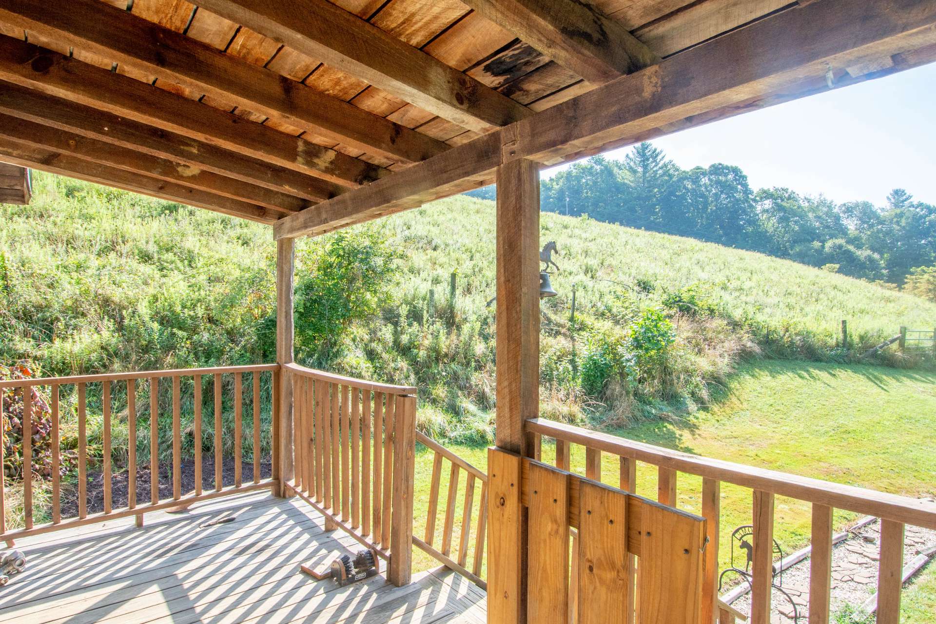 Enjoy the mountain countryside setting from the covered front porch.