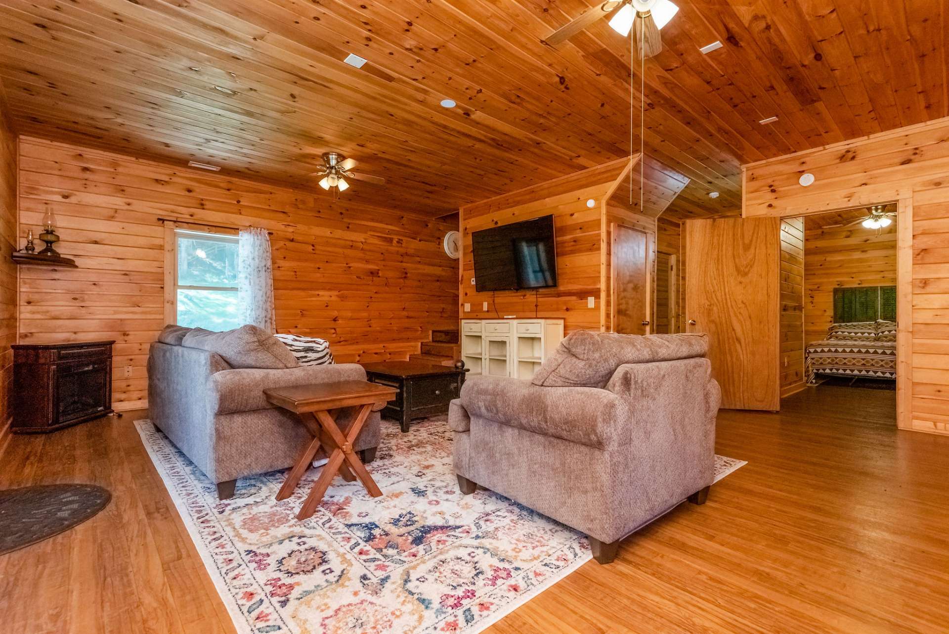 Windows, doors, and warm wood keep this room feeling bright and cheery.