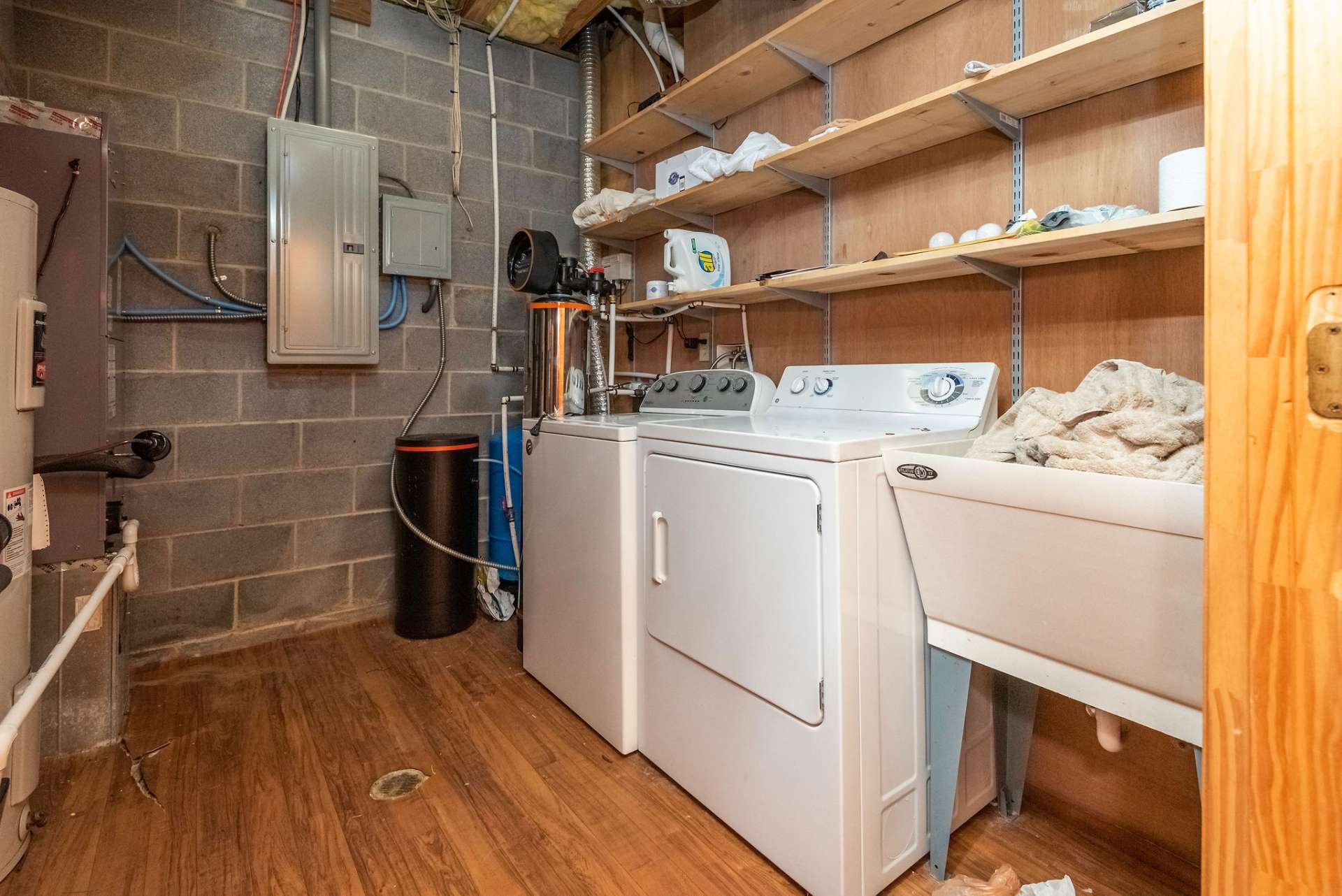 Laundry room equipped with utility sink.