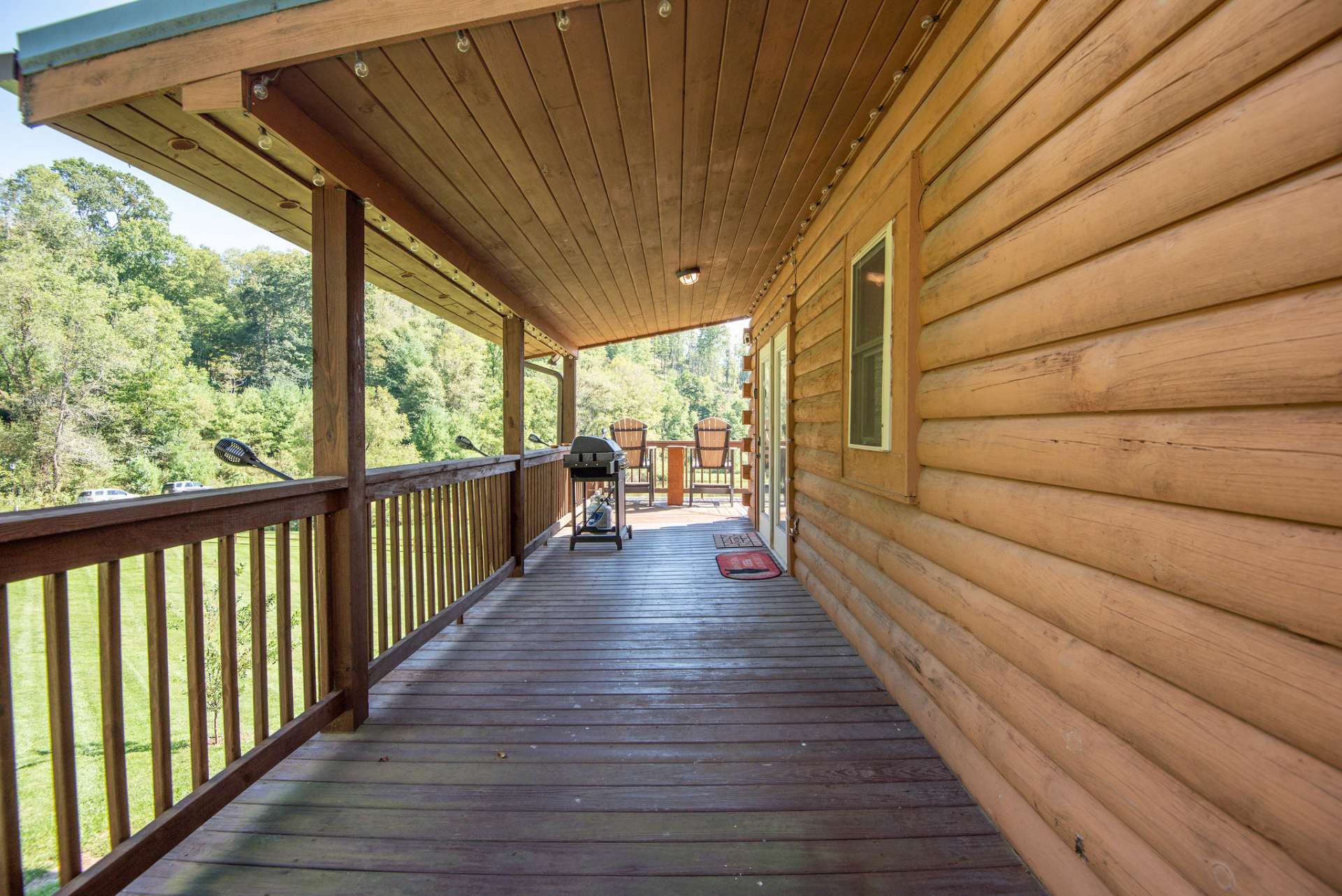 Partially covered wrap around deck for your outdoor grilling, dining, and entertaining.
