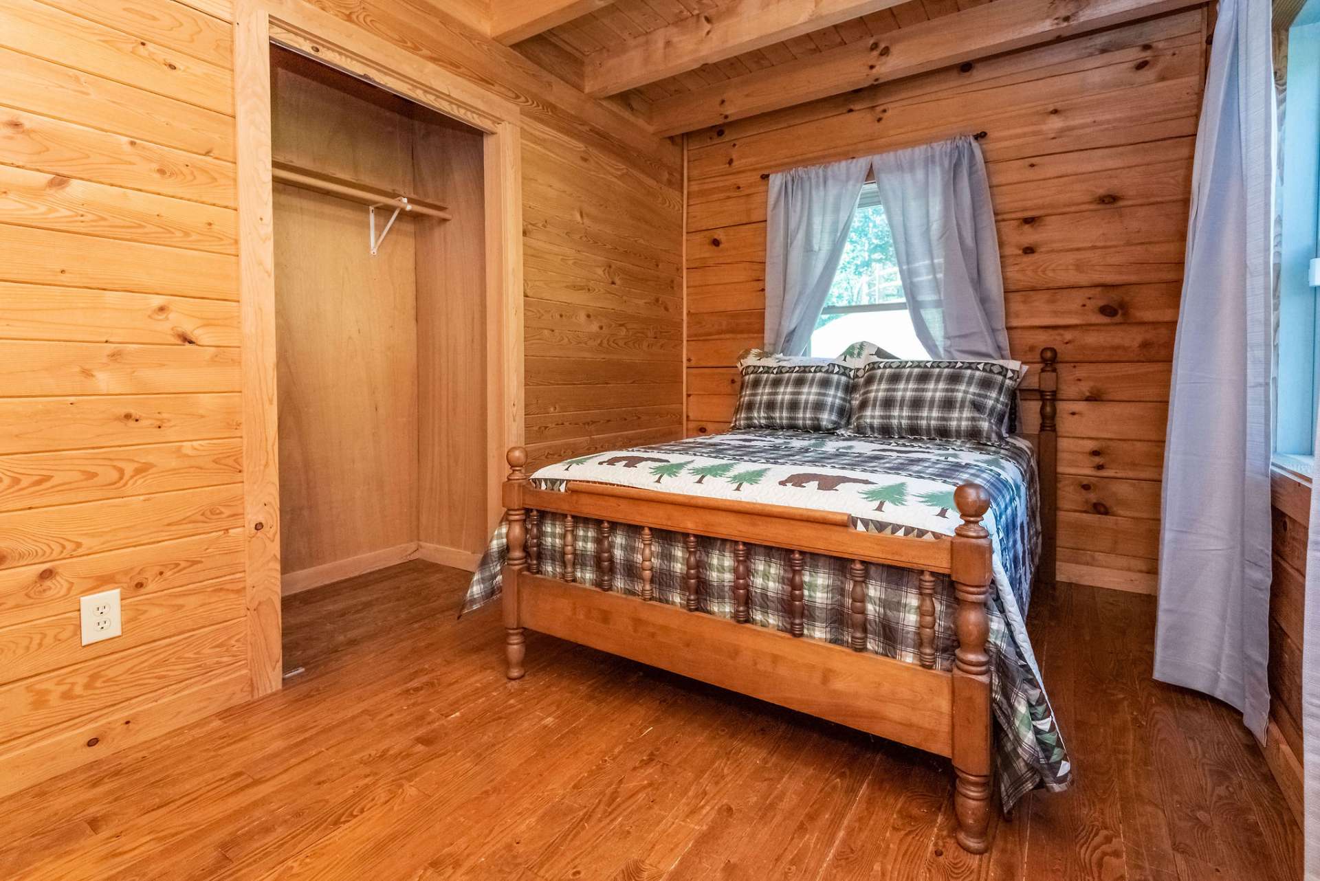 Additional bedroom on main level with view of fruit trees soon to be an orchard.