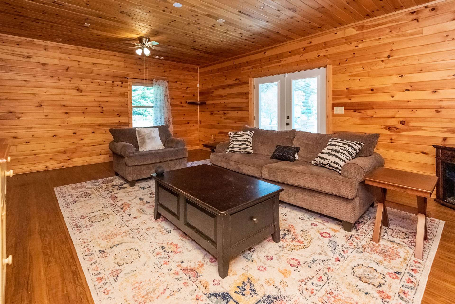 French doors lead to the patio area with fire pit.